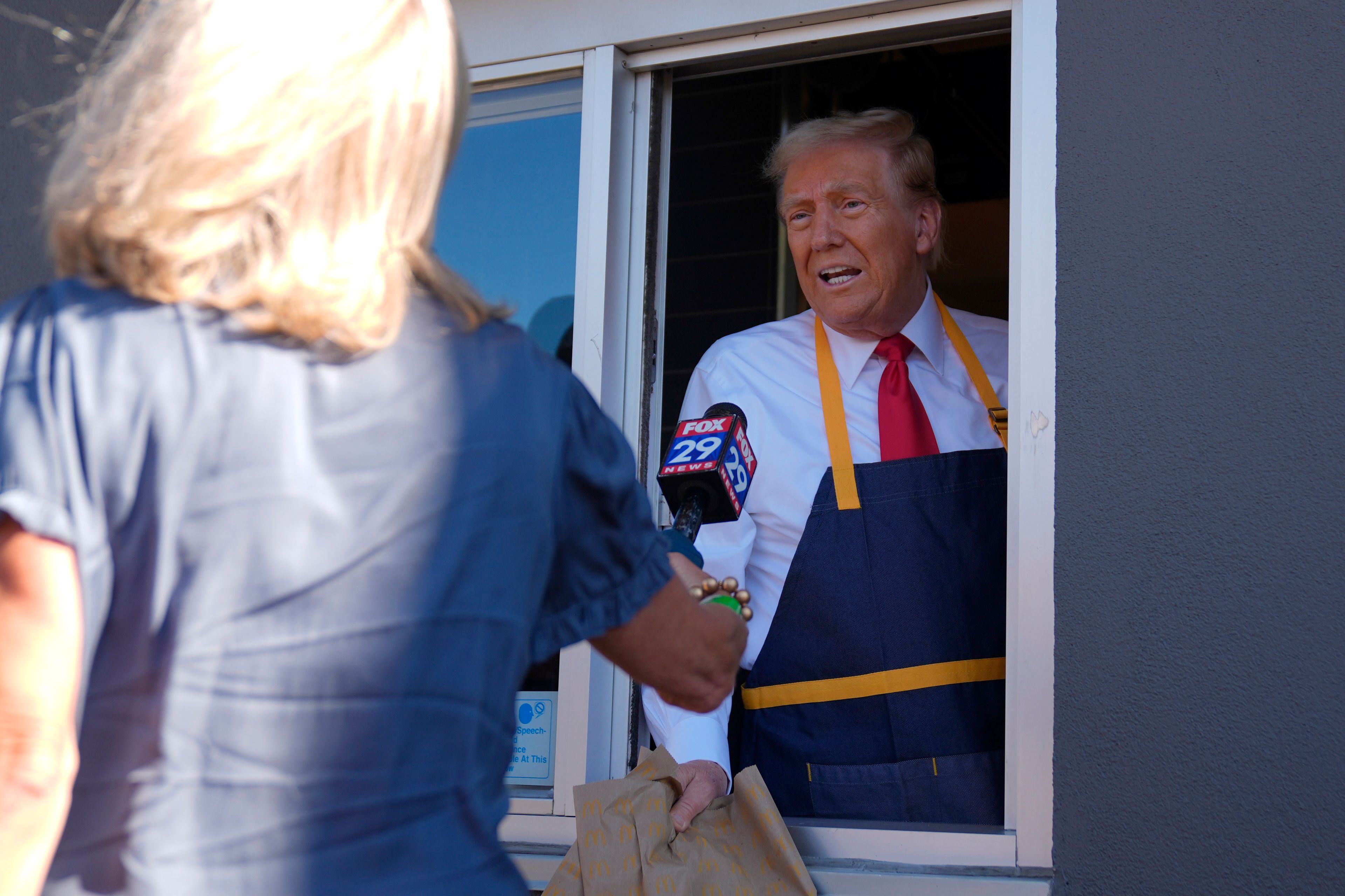 Republican presidential nominee former President Donald Trump speaks during an interview at a drive-thru window during a campaign stop at a McDonald's, Sunday, Oct. 20, 2024, in Feasterville-Trevose, Pa. (AP Photo/Evan Vucci)