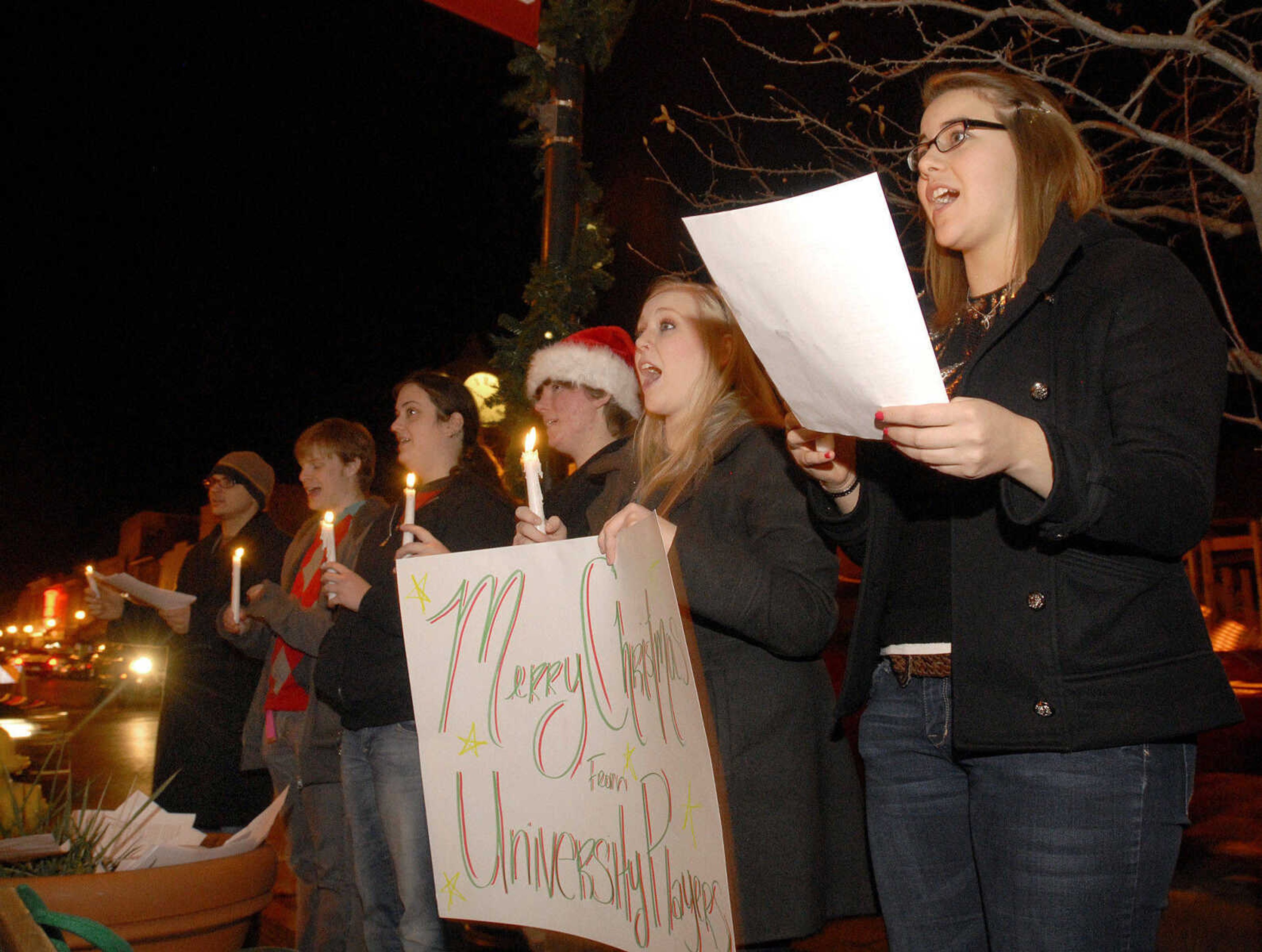 LAURA SIMON ~ lsimon@semissourian.com
The University Players spread holiday cheer on Main Street by singing Christmas carols for all to hear Friday, Dec. 2, 2011 during Old Town Cape's annual Downtown Christmas Open House.