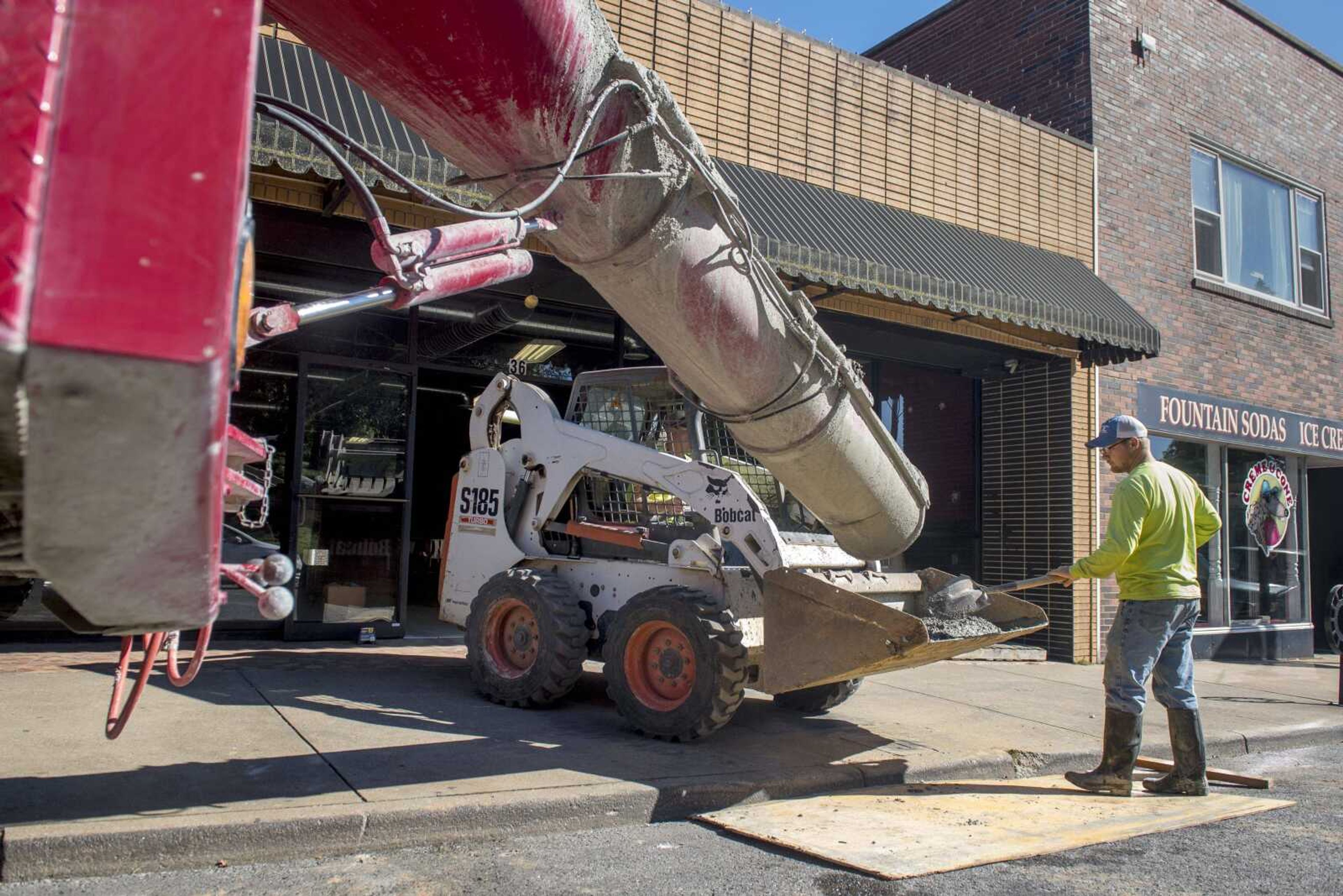 Crews pour concrete for installation inside 36 N. Spanish St. on Thursday. The space which will soon house a new bar, 21 Taps.