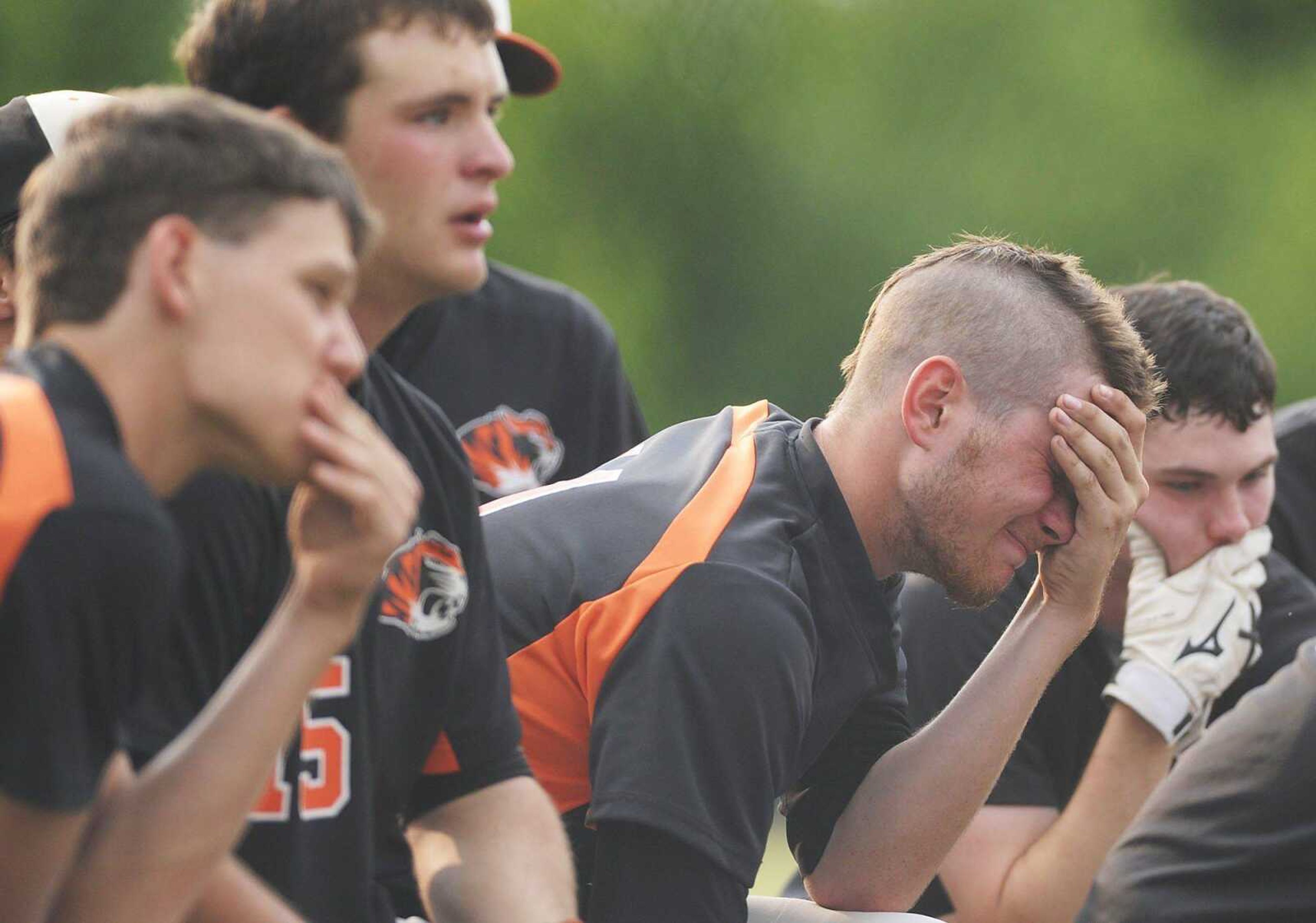 Central players listen to their coaches after a season-ending loss to Rockwood Summit in the Class 4 state quarterfinals Thursday in Fenton, Mo. Rockwood Summit won 13-2 in six innings. (ADAM VOGLER)