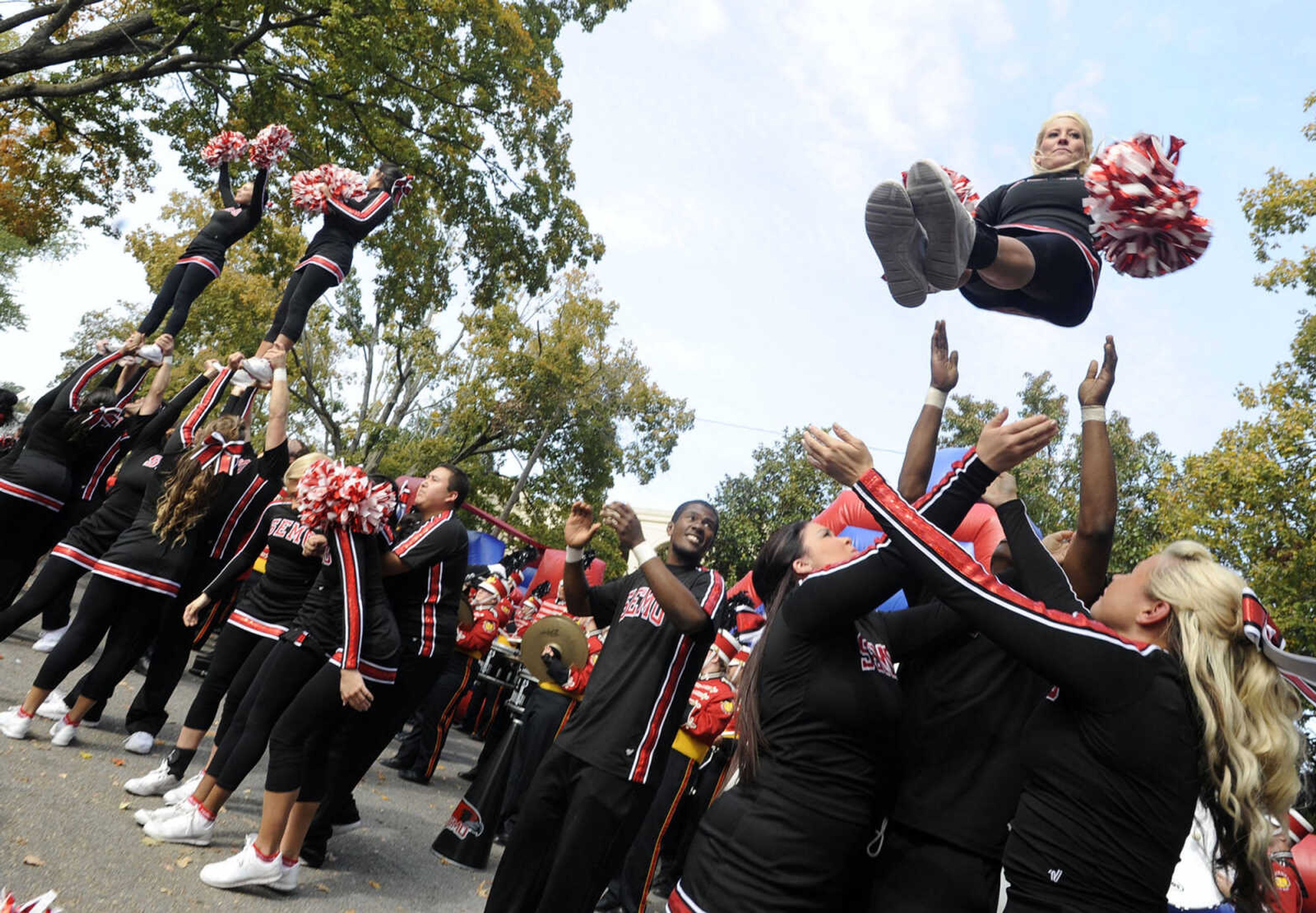 The SEMO cheerleaders fire up the tailgate crowd before the homecoming game with Eastern Kentucky on Saturday, Oct. 26, 2013.