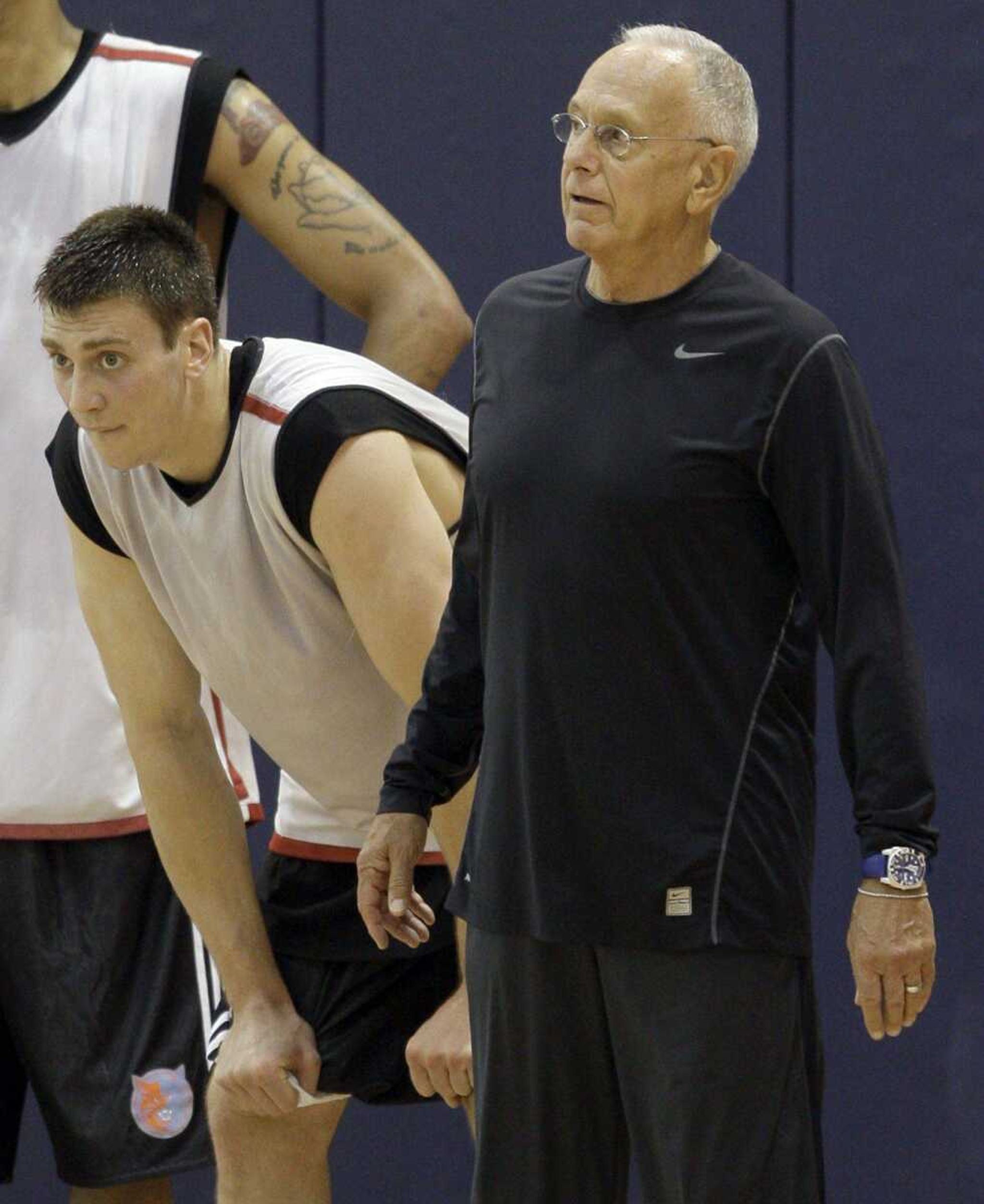 Former North Carolina player Tyler Hansbrough, left, and Charlotte Bobcats coach Larry Brown, right, look on during a pre-draft workout for the NBA basketball team in Charlotte, N.C., Wednesday, June 10, 2009. (AP Photo/Chuck Burton)