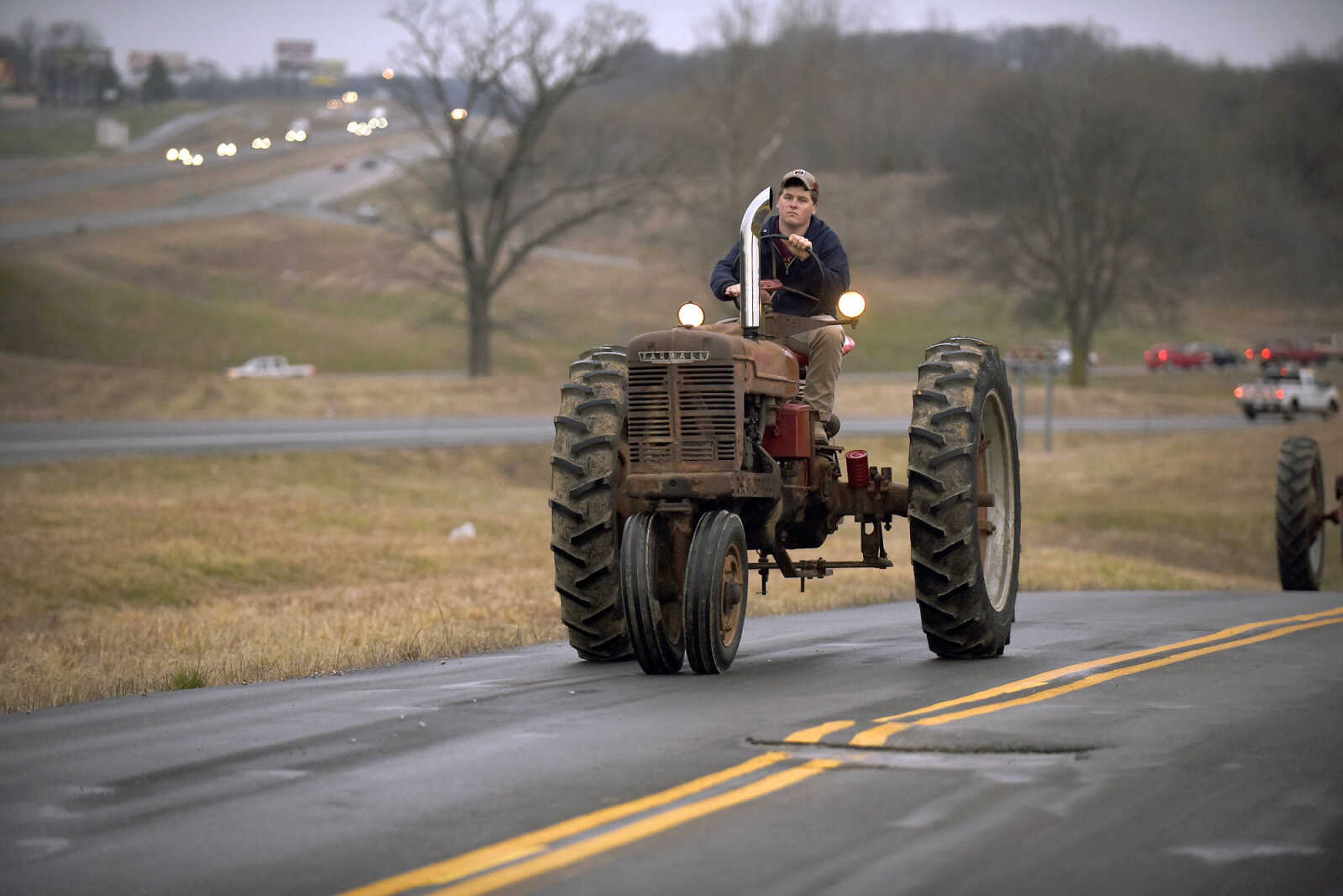 Saxony Lutheran High School FFA students take to the road on their tractors during drive your tractor to school day on Tuesday morning, Feb. 21, 2017. Students began their journey to school from Davis Farm Supply on Highway 61 in Jackson as part of FFA Week.