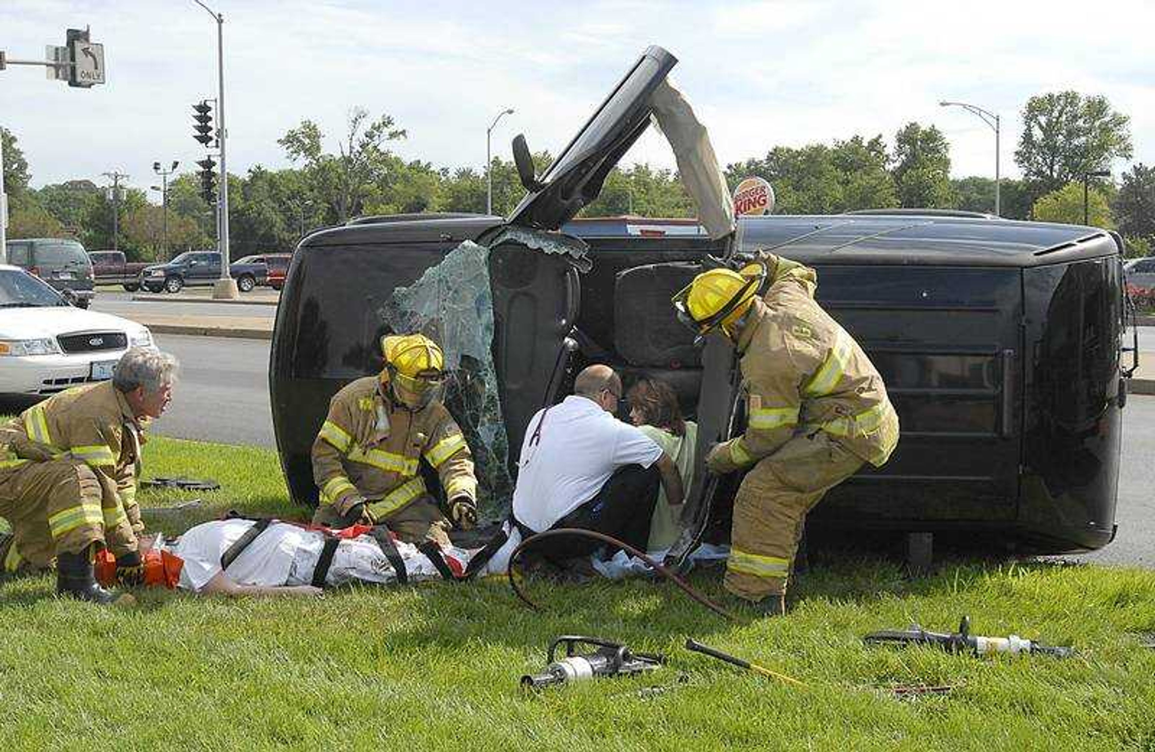 FRED LYNCH ~ flynch@semissourian.com
Cape Girardeau firefighters extricated two people from a vehicle that rolled over Monday on Kingshighway after the driver made a left turn from Broadway. An earlier rain causing a slick street may have been a factor in the driver losing control, according to Cape Girardeau police. A video is available at semissourian.com.