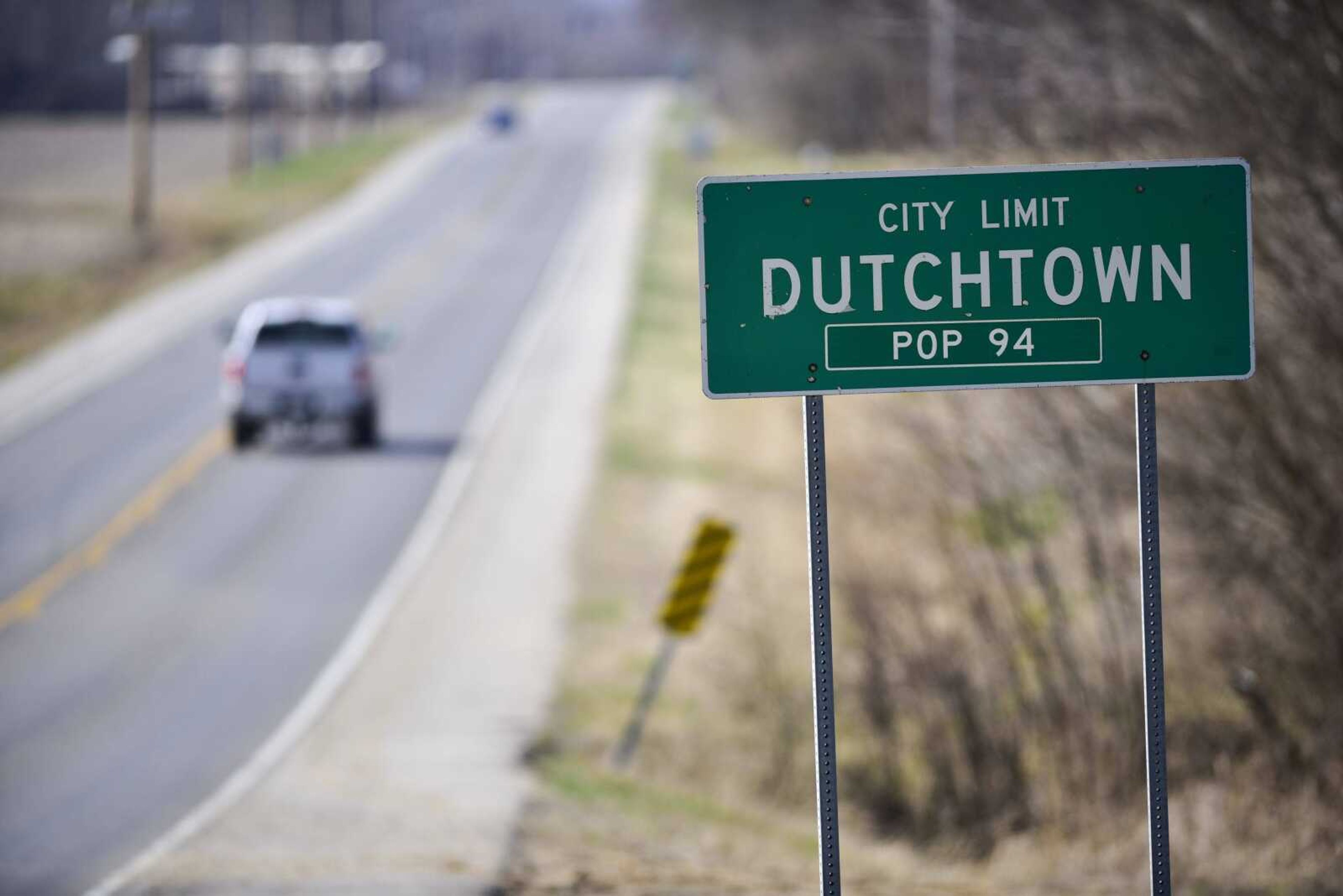 A truck passes the Dutchtown sign along Highway 74 on Thursday in Dutchtown.