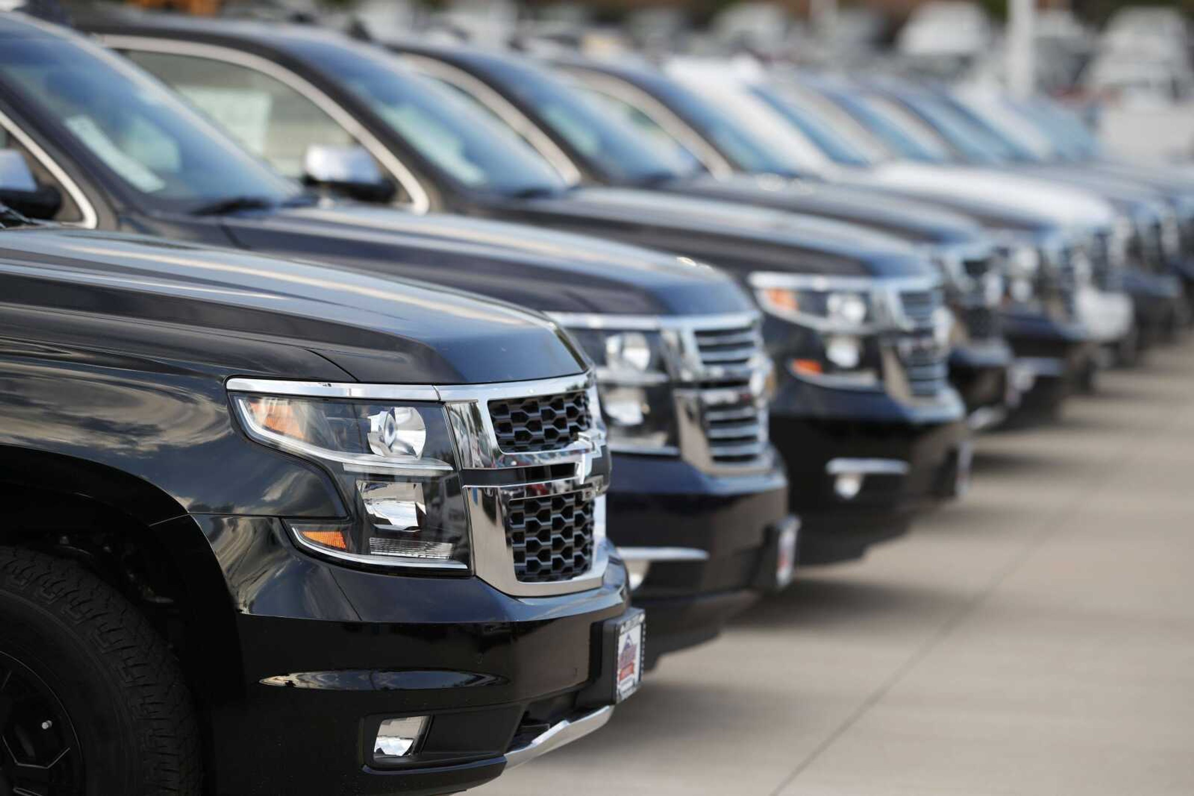 This June 24, 2018, photo shows<br>Unsold 2018 Suburbans are seen June 24 at a Chevrolet dealership in Englewood, Colorado. Automobile sales in the U.S. fell 2% in the first quarter, another sign the nation's economy is starting to slow.