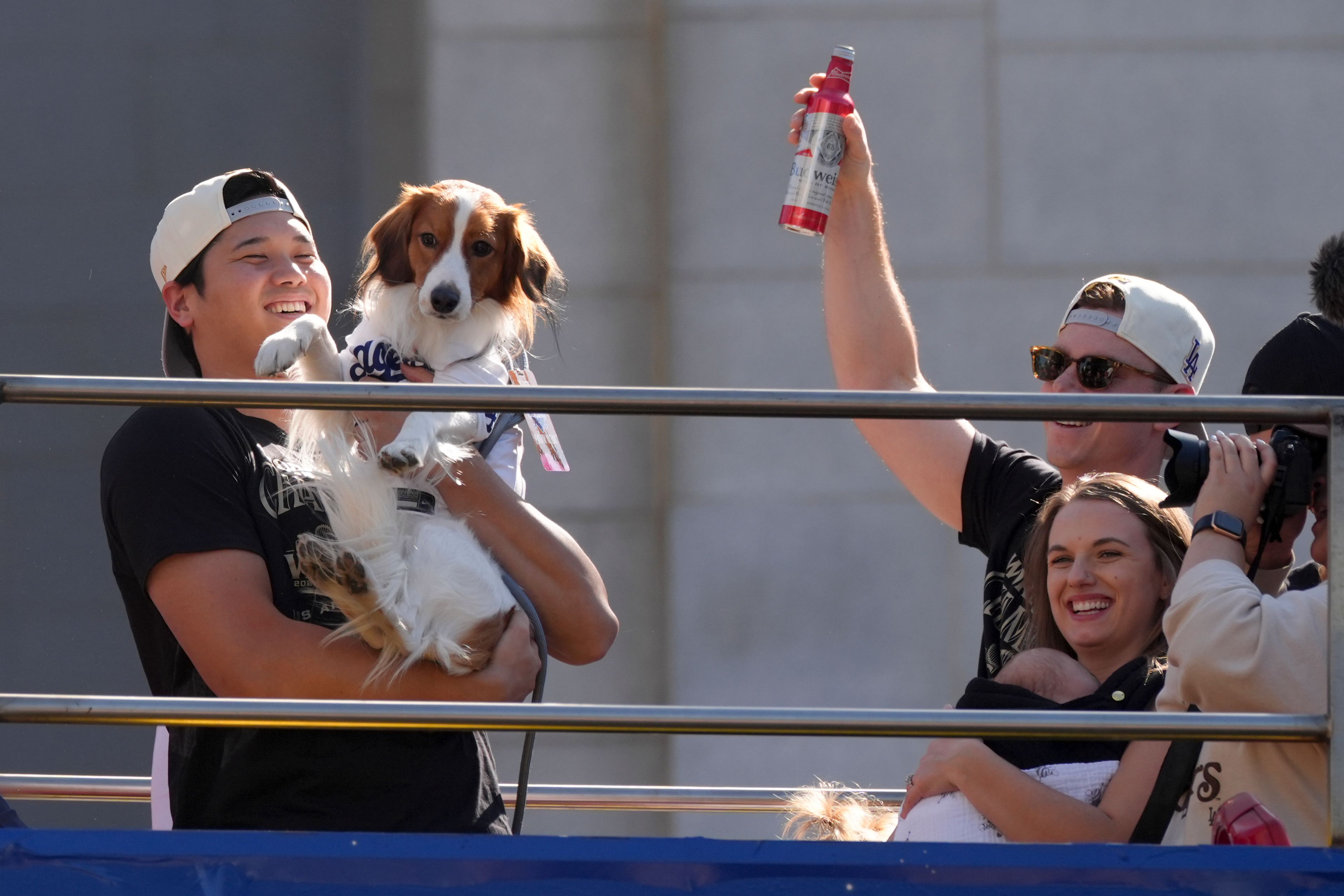 Los Angeles Dodgers' Shohei Ohtani holds his dog Decoy during the Los Angeles Dodgers baseball World Series championship parade Friday, Nov. 1, 2024, in Los Angeles. (AP Photo/Jae C. Hong)