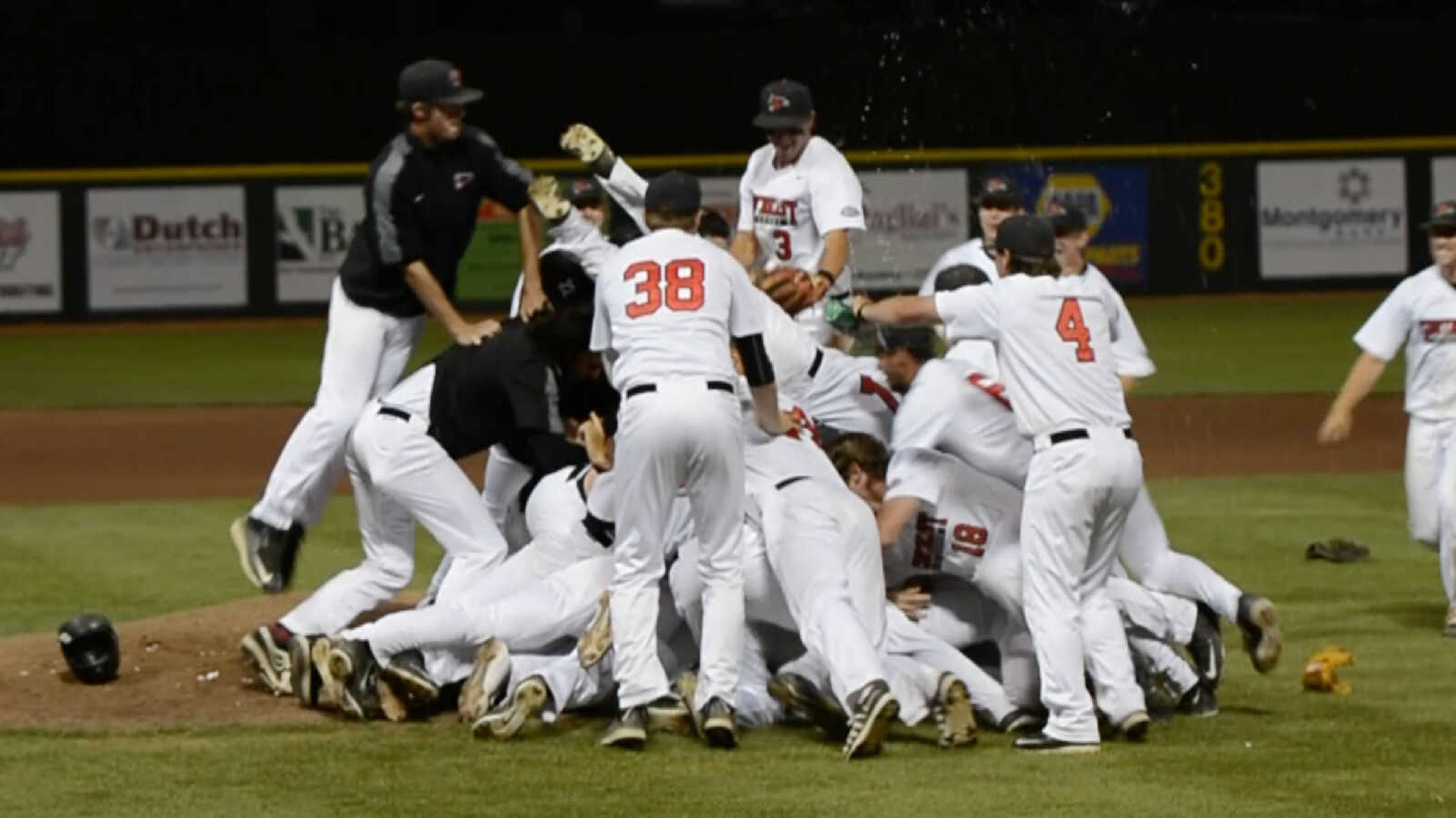 Members of the Southeast Missouri State baseball team celebrate their third consecutive Ohio Valley Conference championship following Thursday's 9-2 victory over Belmont at Capaha Field.