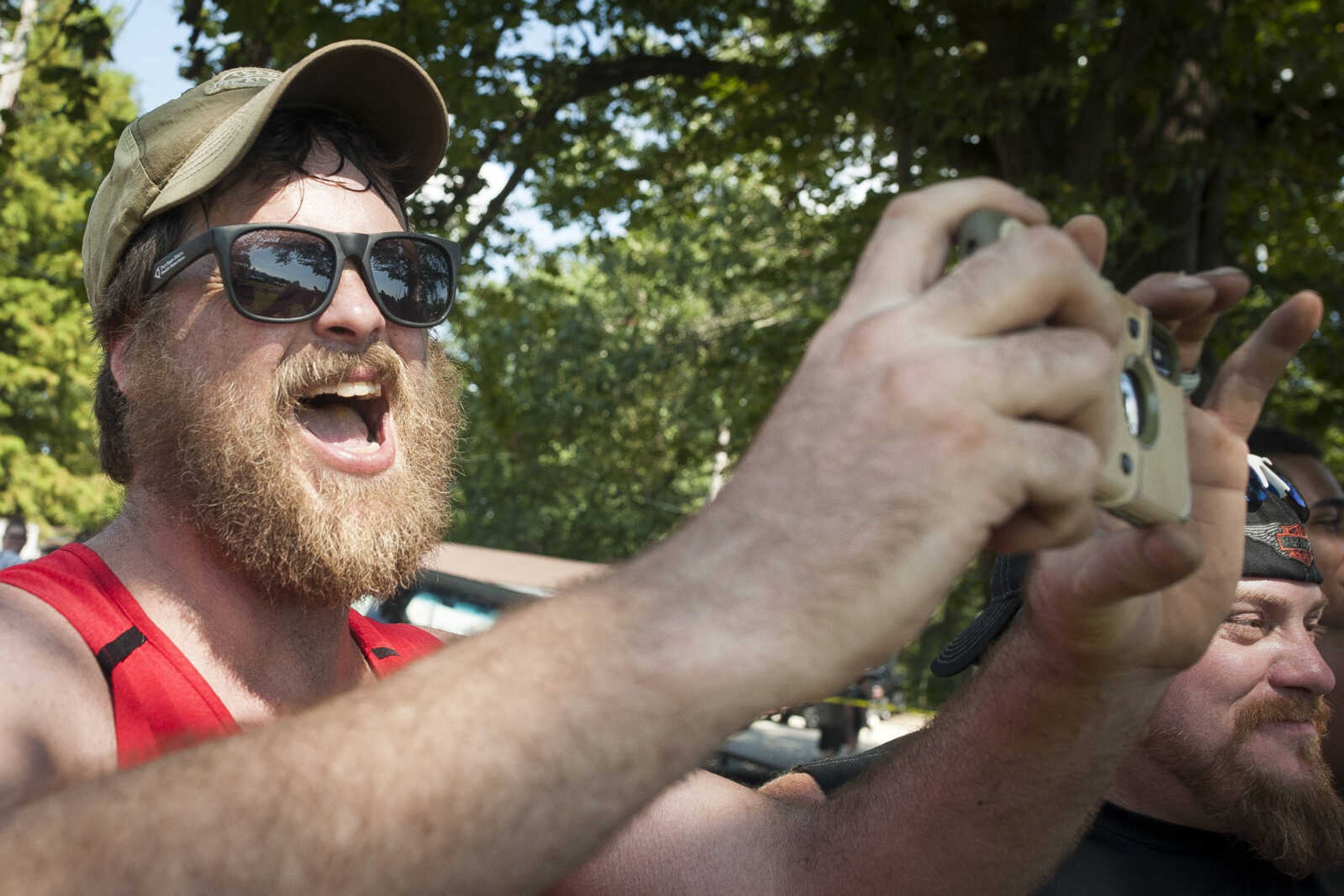 Rick Jenkins cheers for his 14-year-old son, Matthew, at the annual mud races during Benton Neighbor Days  Saturday, Aug. 31, 2019 in Benton.