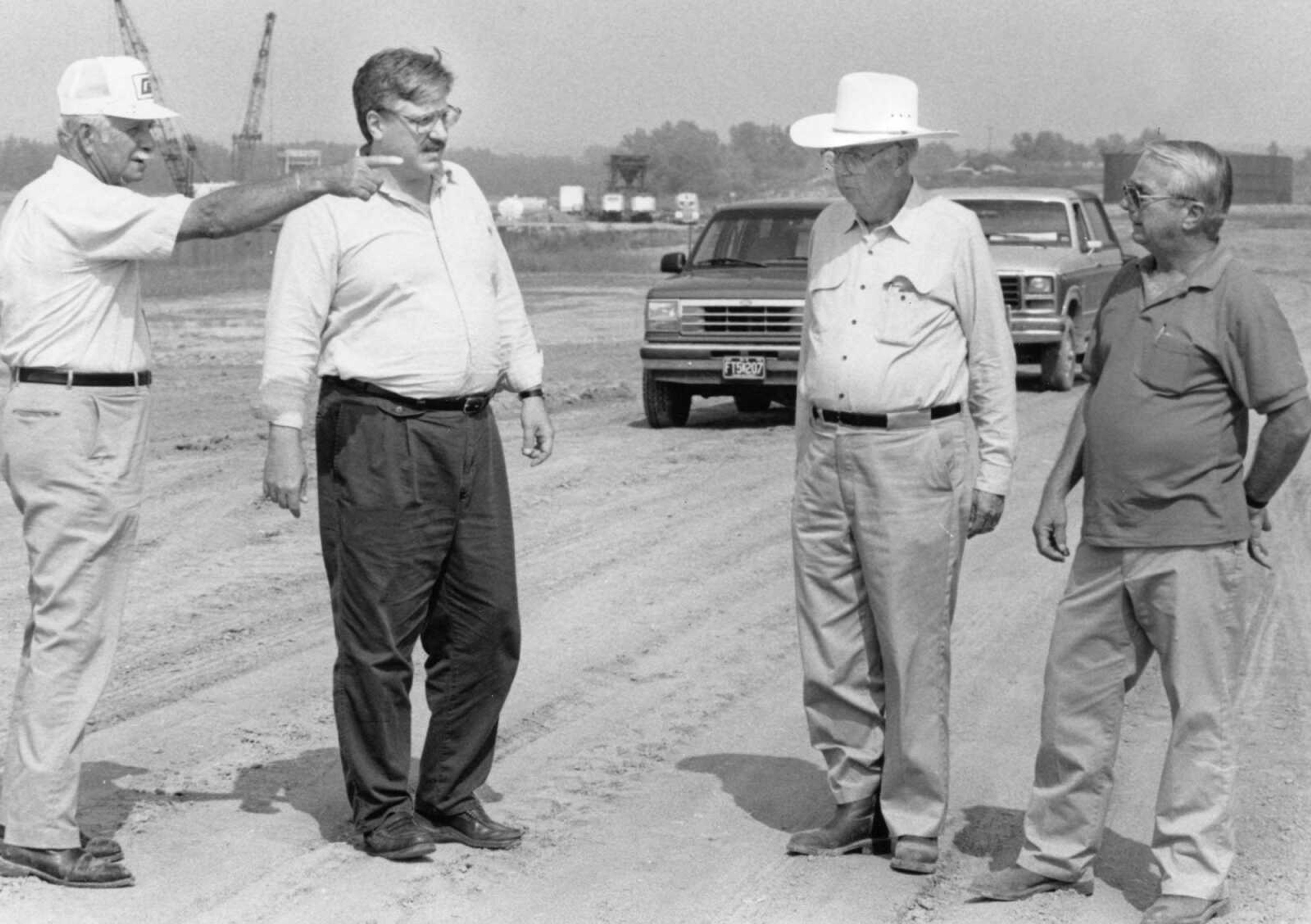 Published Sept. 6, 1992.
The final inspection of construction on phase one of the rail spur into the Southeast Missouri Regional Port Authority was held Sept. 4, 1992. From left, Fred Surman, port commissioner; Allan Maki, port executive director; Irvin Garms, commissioner, and Jim Lawson, Bowen and Lawson Engineering of Jackson, inspected the railroad bed. (Southast Missourian archive)