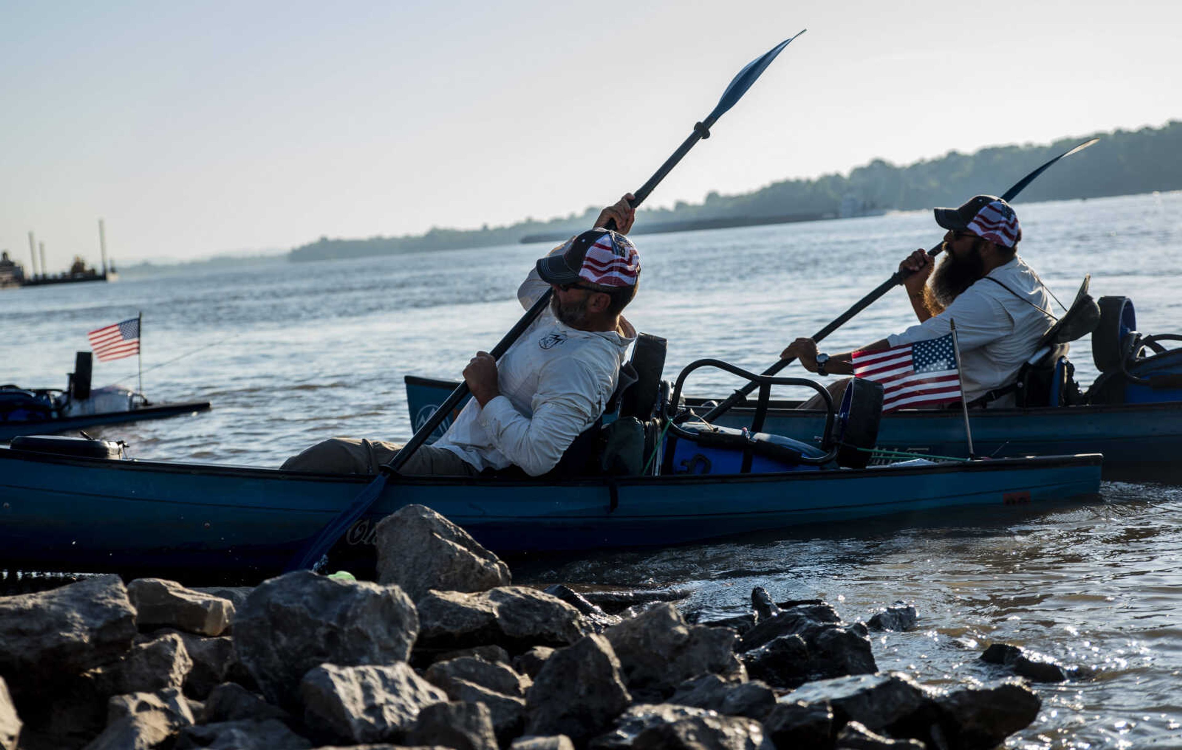 Rick Baine, left, and Ryan Webb, right, push off from the loading dock at Red Star Dock as they resume their excursion down the Mississippi River Tuesday, Aug. 28, 2018 in Cape Girardeau. The two, along with Matt Roy (not pictured) are participating in the Warrior Paddle Expedition, beginning at the source of the Mississippi River, Lake Itasca, Minnesota, and will conclude their excursion in the Gulf of Mexico.