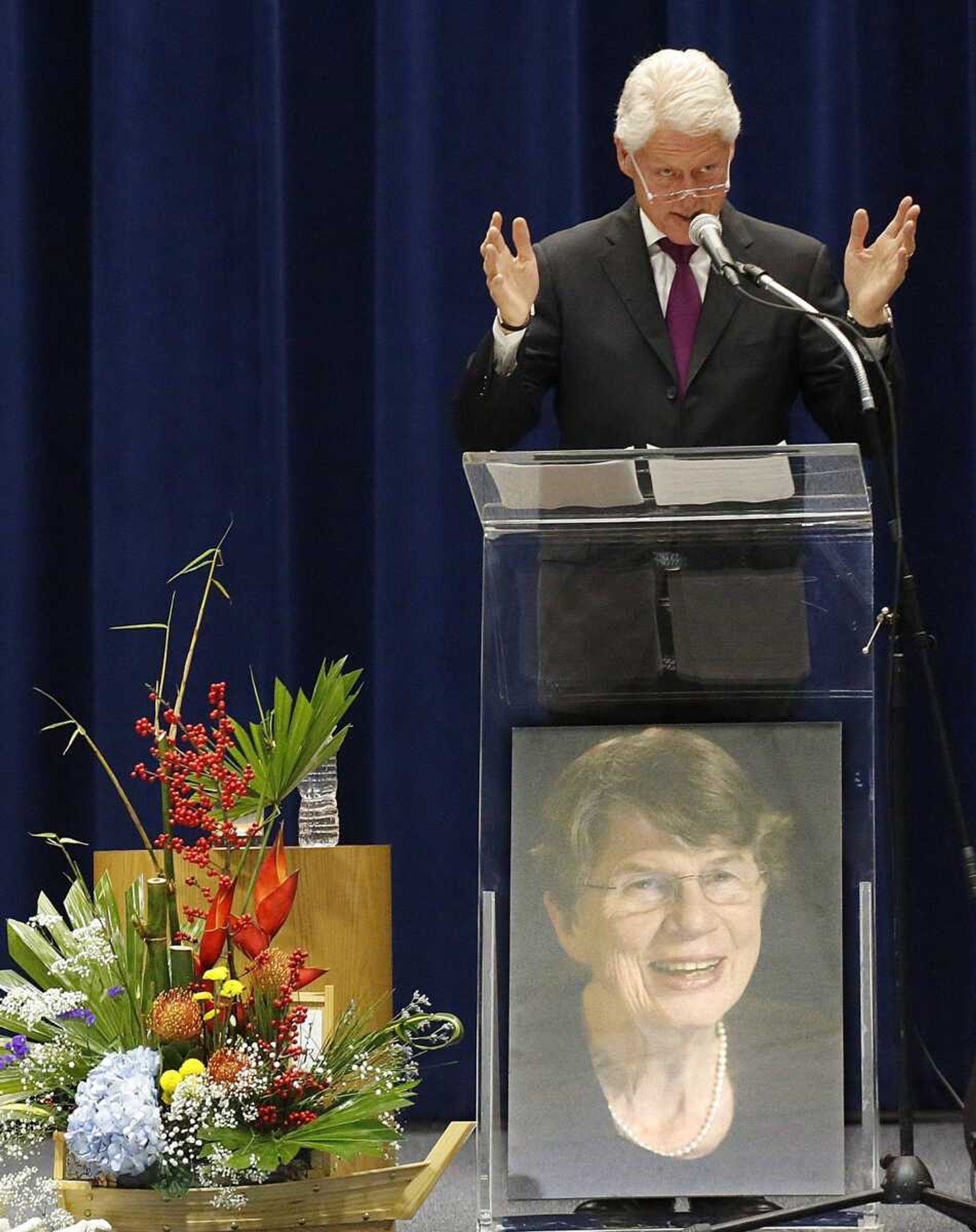 Former U.S. President Bill Clinton delivers the eulogy at a public memorial service honoring former Attorney General Janet Reno, Sunday, Dec. 11, 2016, in Miami. Reno died Nov. 7 at age 78 from complications from Parkinson's disease. (Carl Juste/Miami Herald via AP)