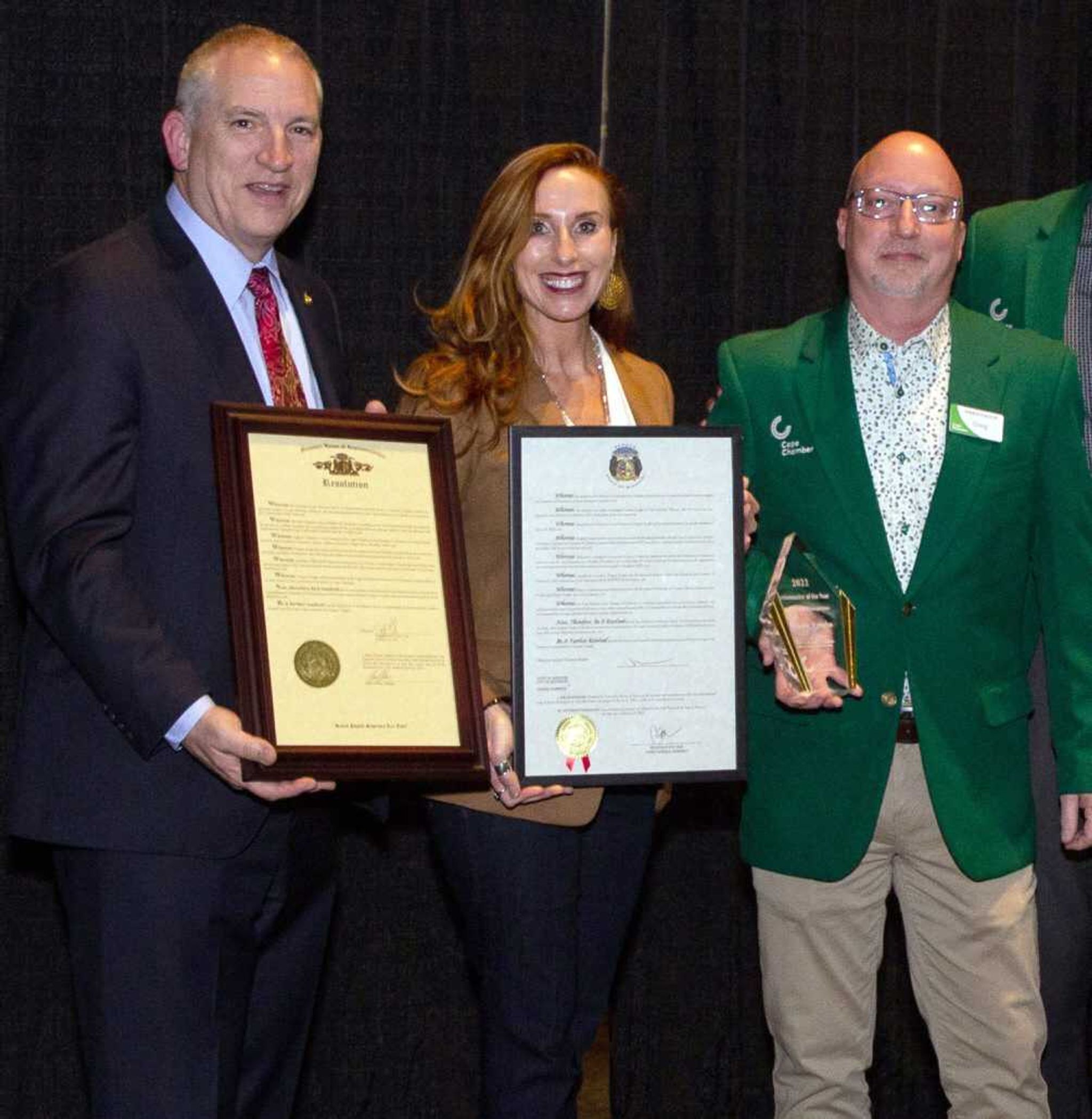 Greg Vaughn, right, wins the Chamber Ambassador of the Year award at the Cape Girardeau Area Chamber of Commerce annual dinner Friday, March 31, at the Show Me Center in Cape Girardeau. At left are state Rep. John Voss and state Sen. Holly Thompson Rehder, who presented resolutions to the chamber from the Missouri House and Senate, respectivly.