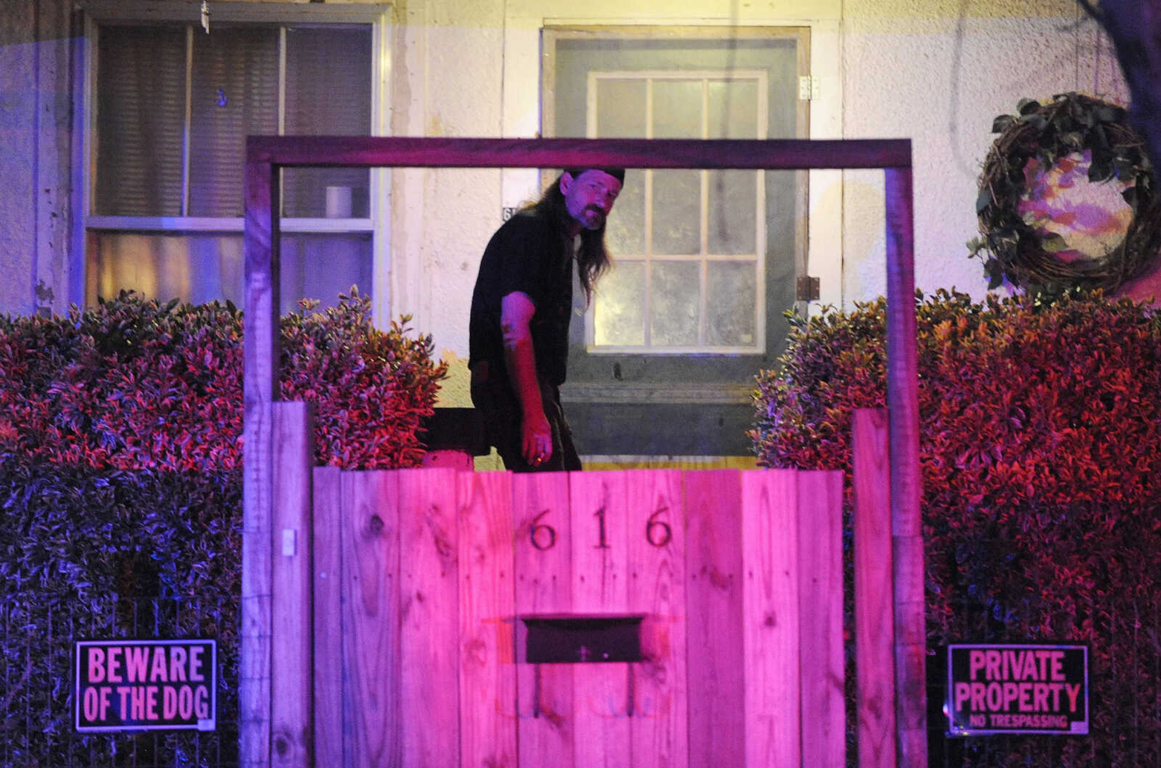 LAURA SIMON ~ lsimon@semissourian.com

A neighbor stands in his front yard as members of the Cape Girardeau Police Department investigates the scene of a fatal shooting at 612 Locust Street on Thursday night, March 31, 2016.