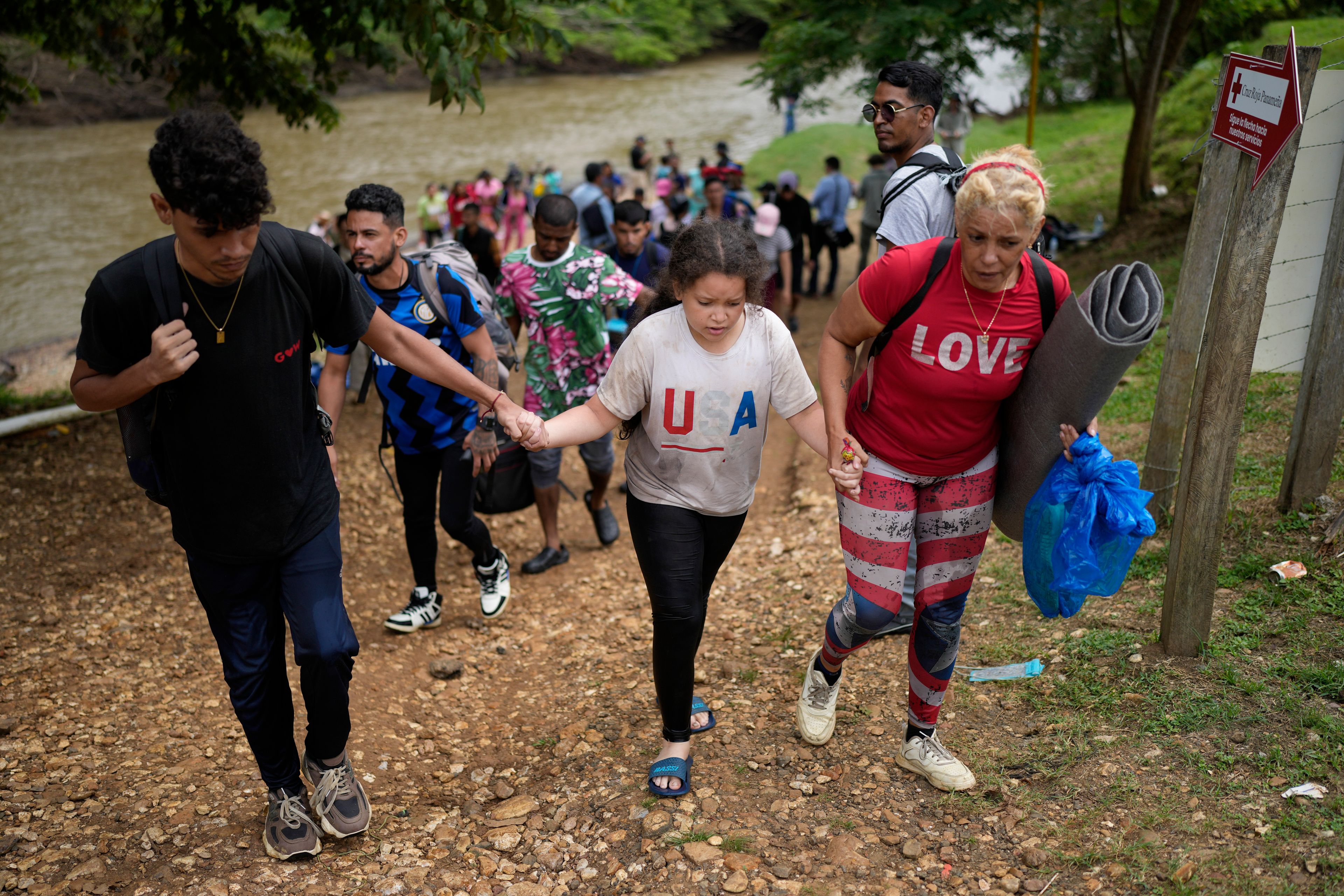 Migrants arrive to Lajas Blancas, Panama, after trekking across the Darien Gap from Colombia in hopes of reaching the U.S., Thursday, Sept. 26, 2024. (AP Photo/Matias Delacroix)