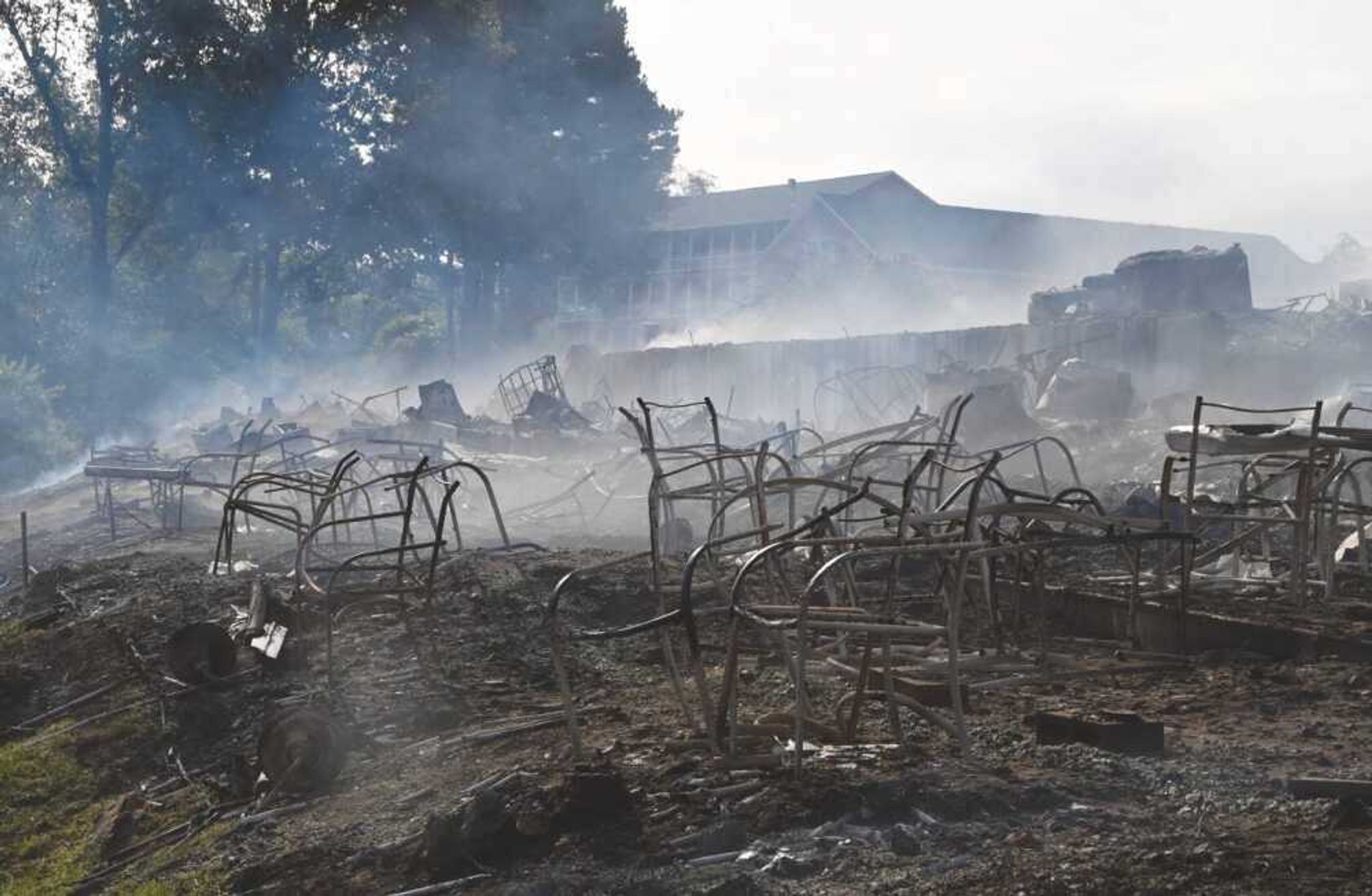 harred chairs sit among the debris at The Landing in Van Buren, which was destroyed in an overnight fire early Wednesday.