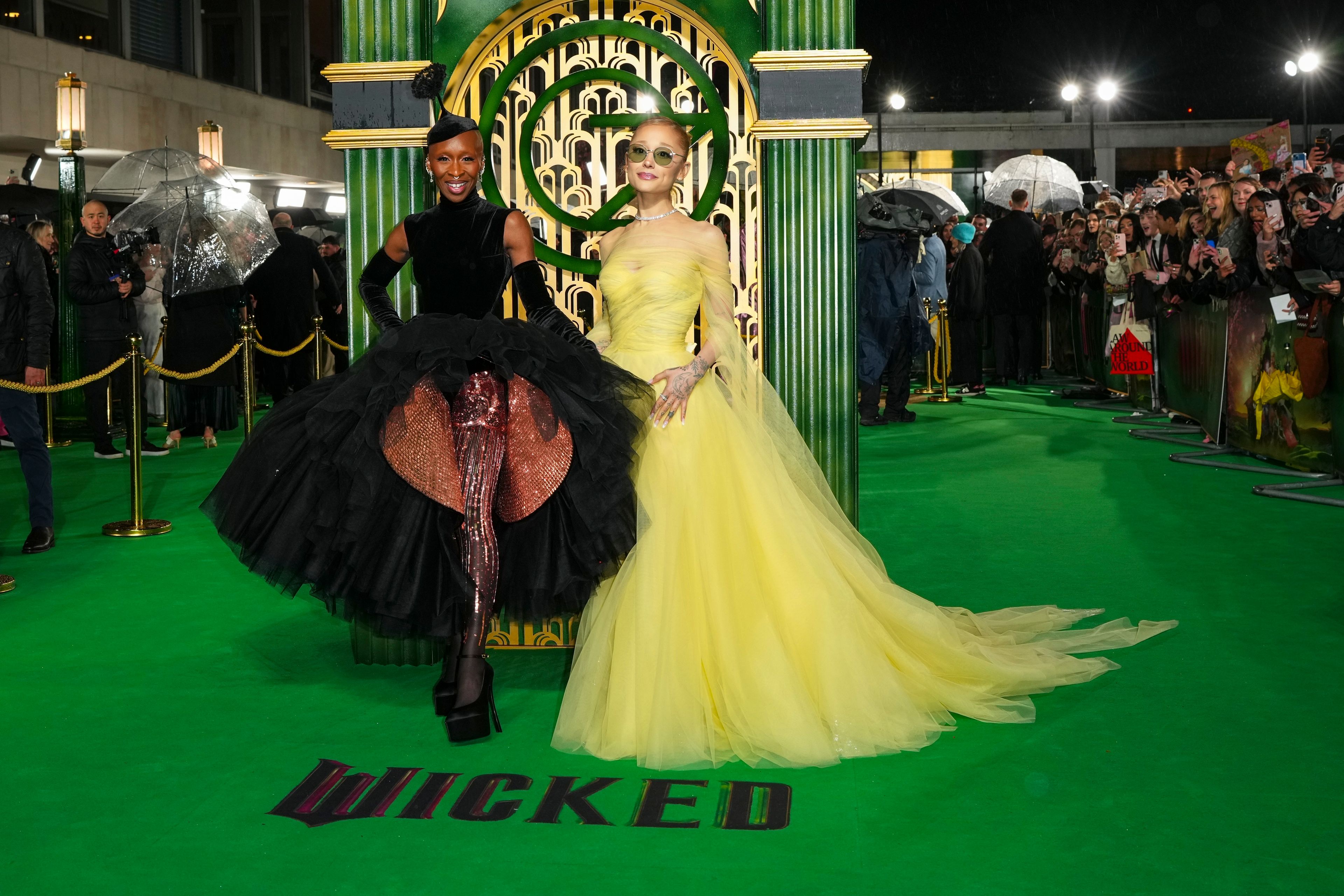 FILE - Cynthia Erivo, left, and Ariana Grande pose for photographers upon arrival at the premiere of the film 'Wicked' on Monday, Nov. 18, 2024, in London. In “Wicked,” Elphaba and Glinda travel from Shiz University to the Emerald City on a glistening green train to meet the wizard. In real life, Cynthia Erivo and Ariana Grande have traveled much farther and wider and longer and on airplanes to promote their hotly anticipated film. (Photo by Scott A Garfitt/Invision/AP, File)