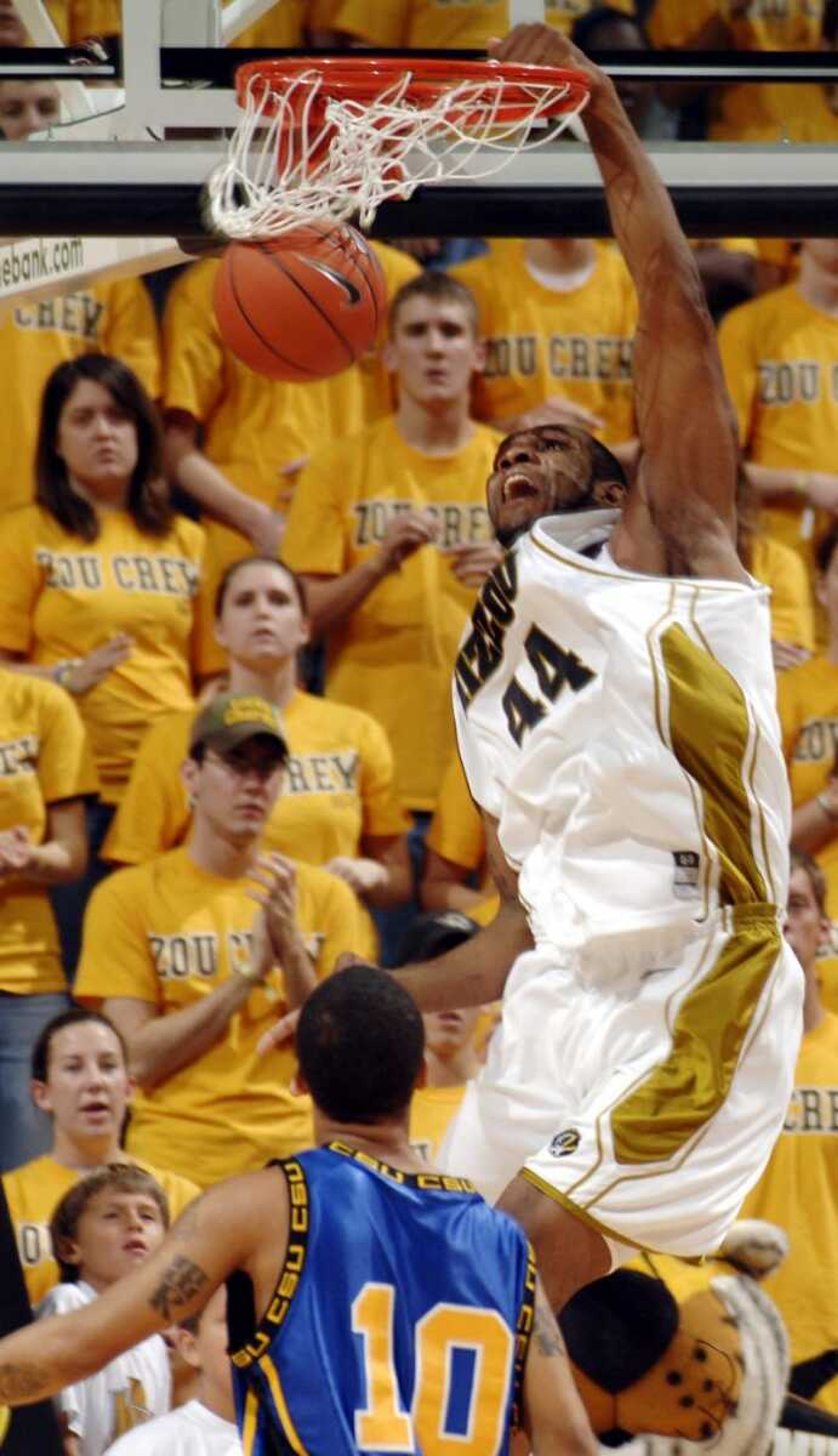 Missouri's Kalen Grimes, dunked over Coppin State's Darryl Roberts during the first half Monday in Columbia, Mo. (L.G. PATTERSON ~ Associated Press)