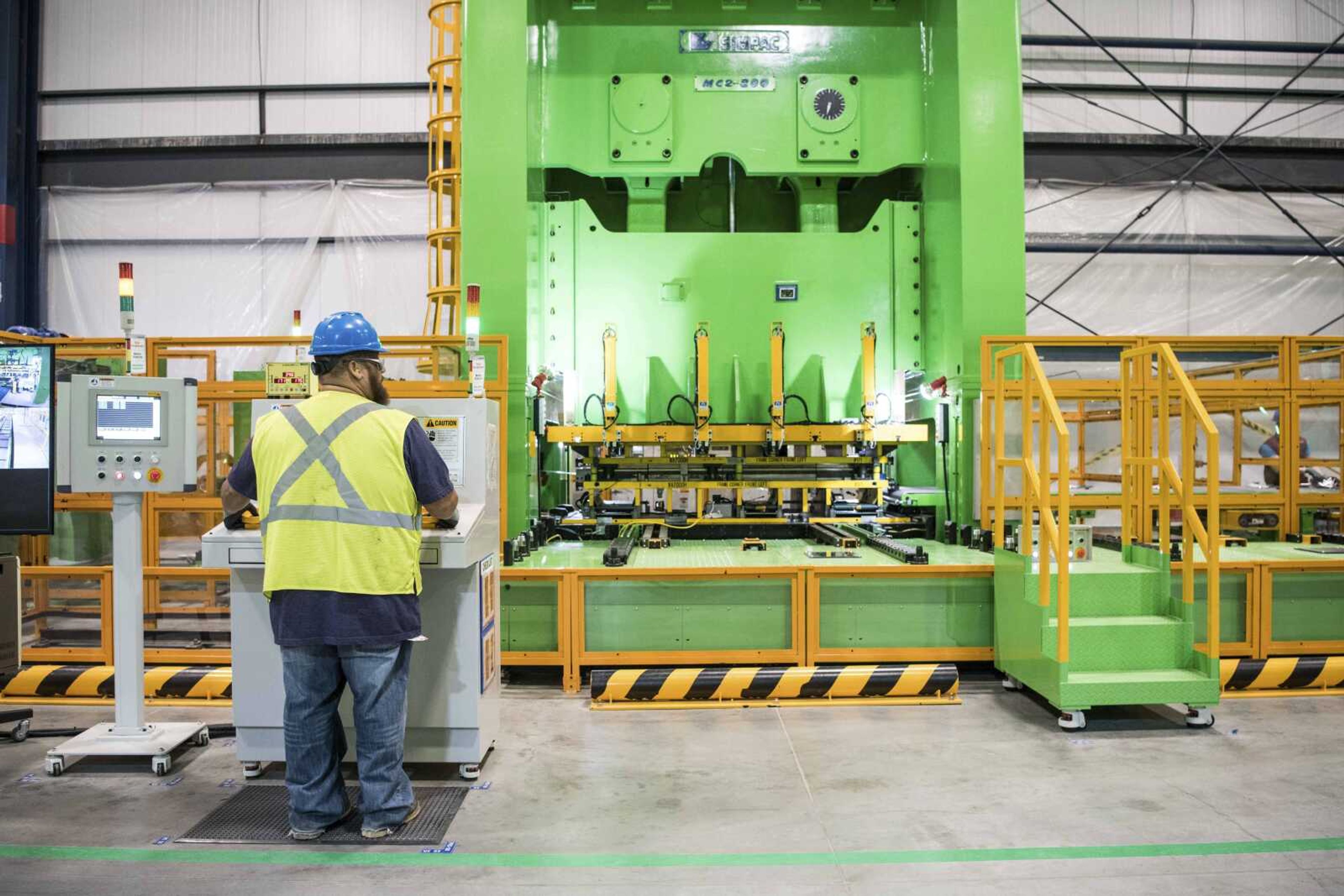 A worker operates a press at the Samsung washing machine facility in Newberry, South Carolina. Friday's latest update on employment across the country showed 18,000 additional manufacturing jobs in May.