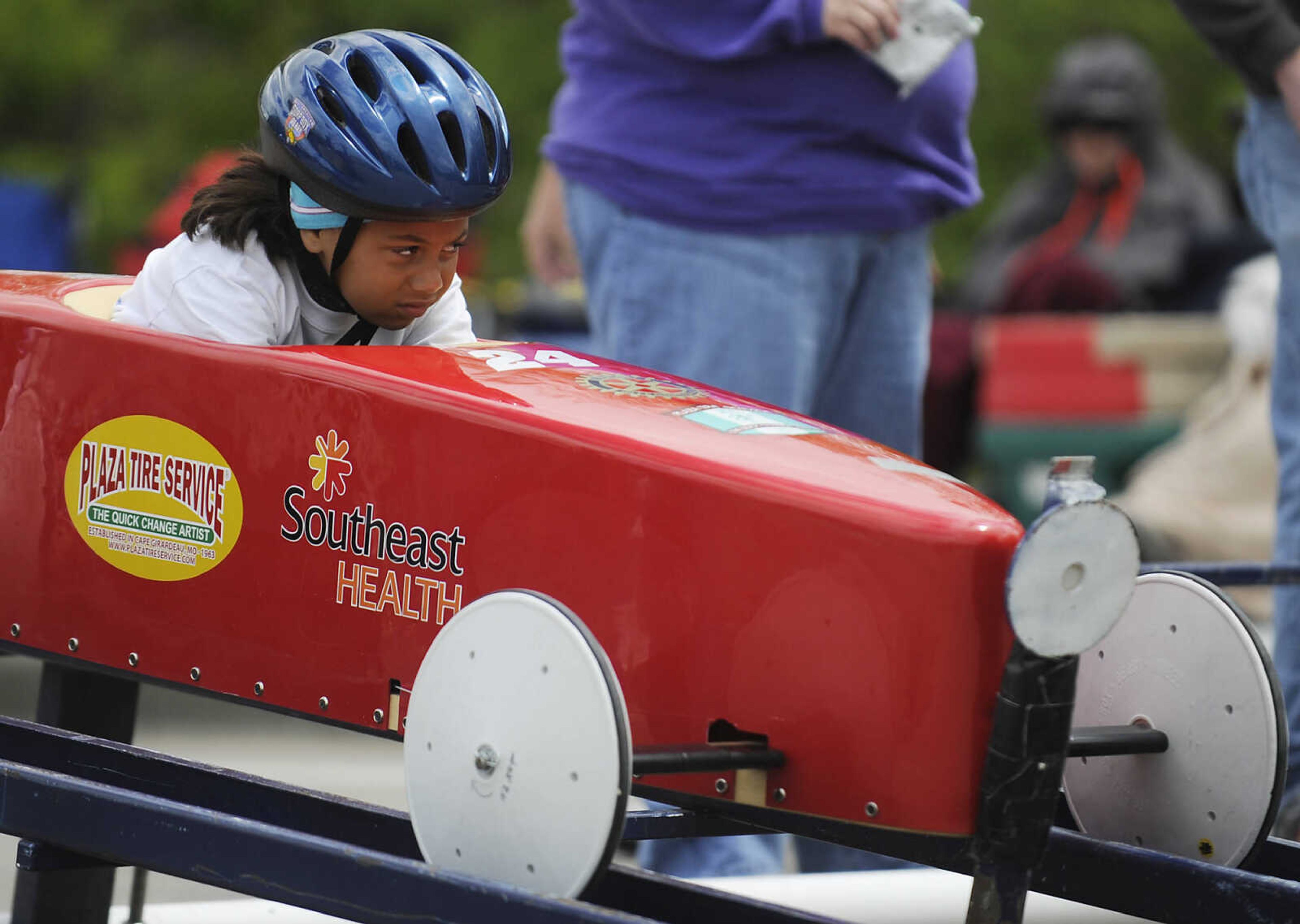 Marissa Byrd, 9,  looks over at her competition before the start of their race during the 2013 Soap Box Derby Saturday, May 4, at Blanchard Elementary School, 1829 N. Sprigg St., in Cape Girardeau. Racers ranging in age from 7 to 17 competed in two divisions at the event which is a fundraiser for the Cape Girardeau Rotary Club. The winners in each division will go on to compete in the All-American Soap Box Derby held in Akron, Ohio in July.