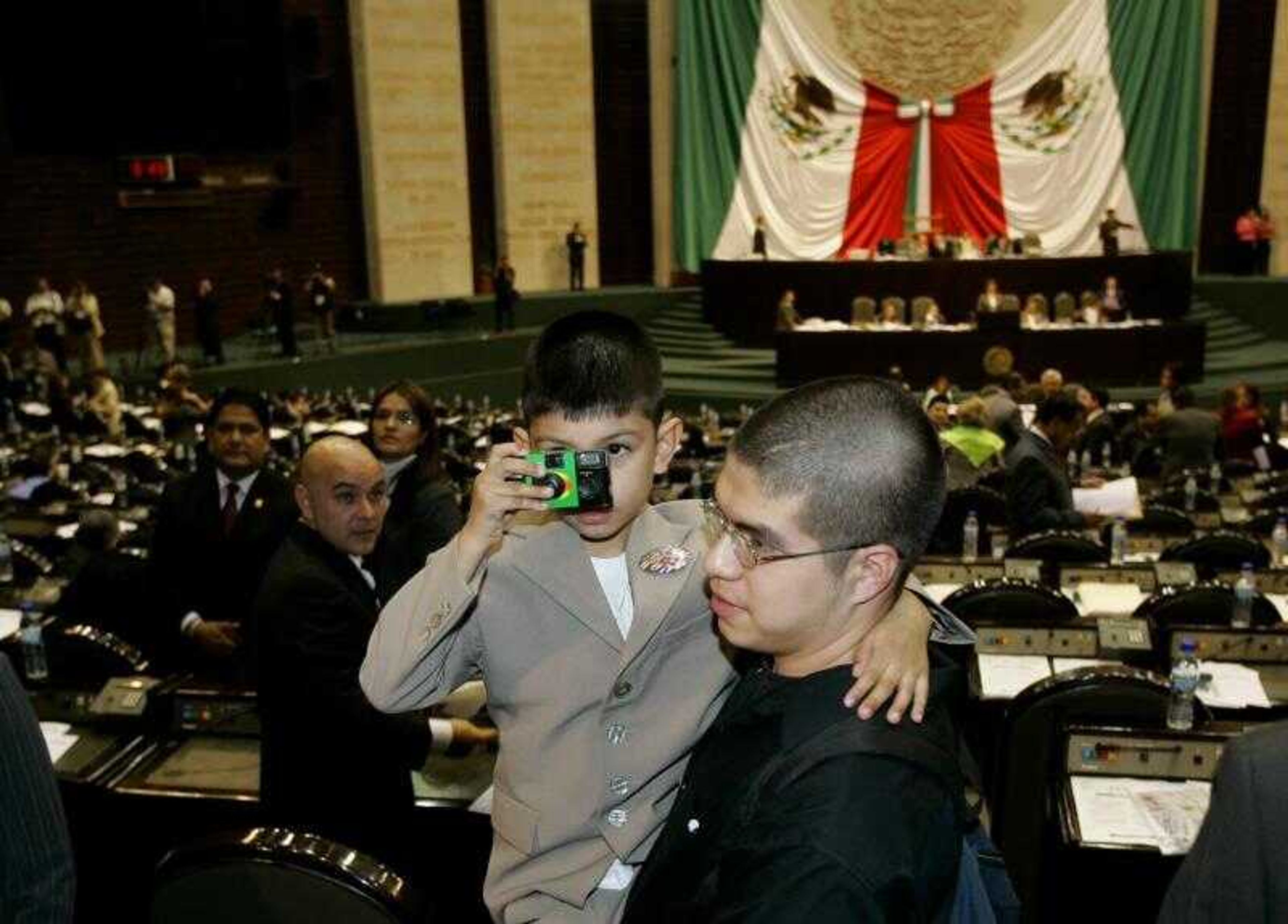 Saul Arellano, 7, of Chicago took a picture at the Mexican Congress in Mexico City, Mexico, Tuesday.