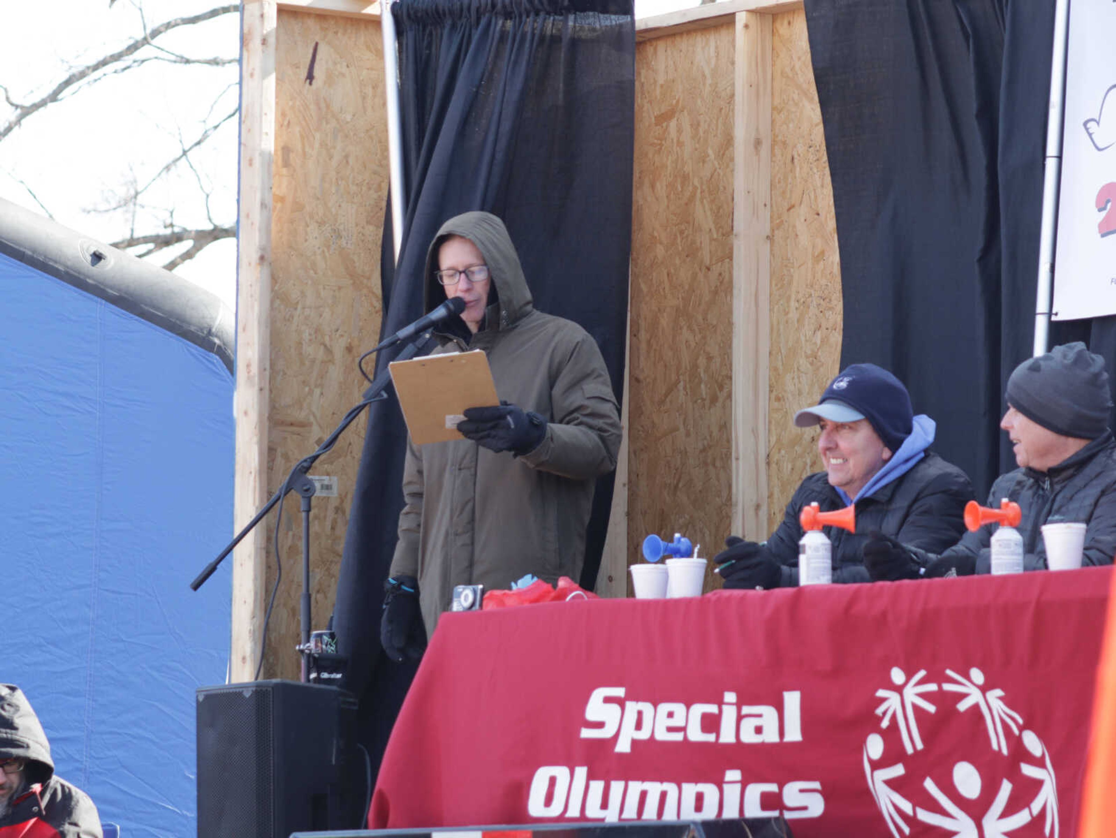 Polar Plunge MC Kirby Ray announces participants getting ready to start the plunge.