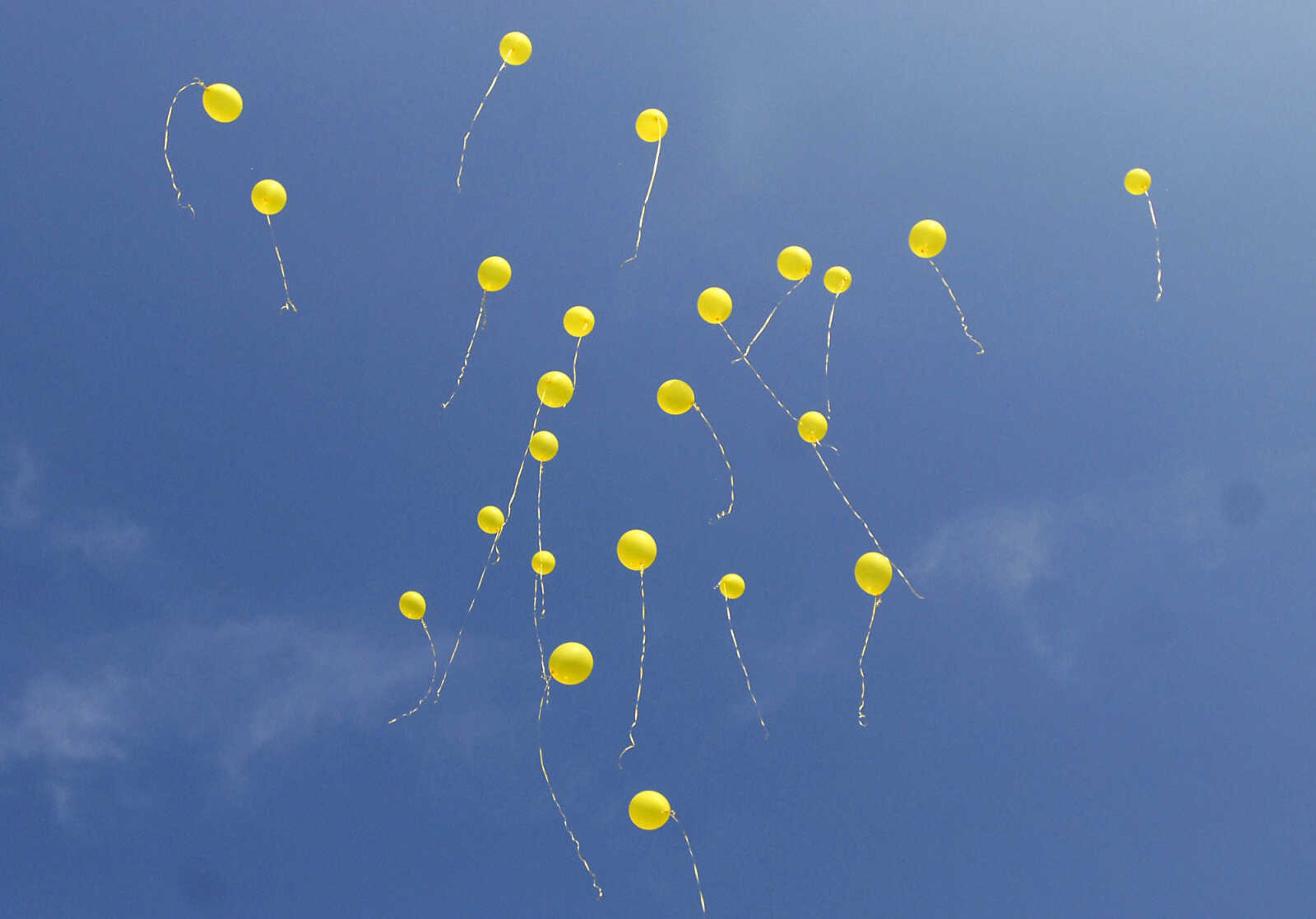 KRISTIN EBERTS ~ keberts@semissourian.com

Friends and family members release balloons during a prayer service for Jacque Sue Waller at Anthem Blue Cross Blue Shield in Cape Girardeau on Saturday, June 4, 2011. Waller, a 39-year-old mother of three has been missing since Wednesday.