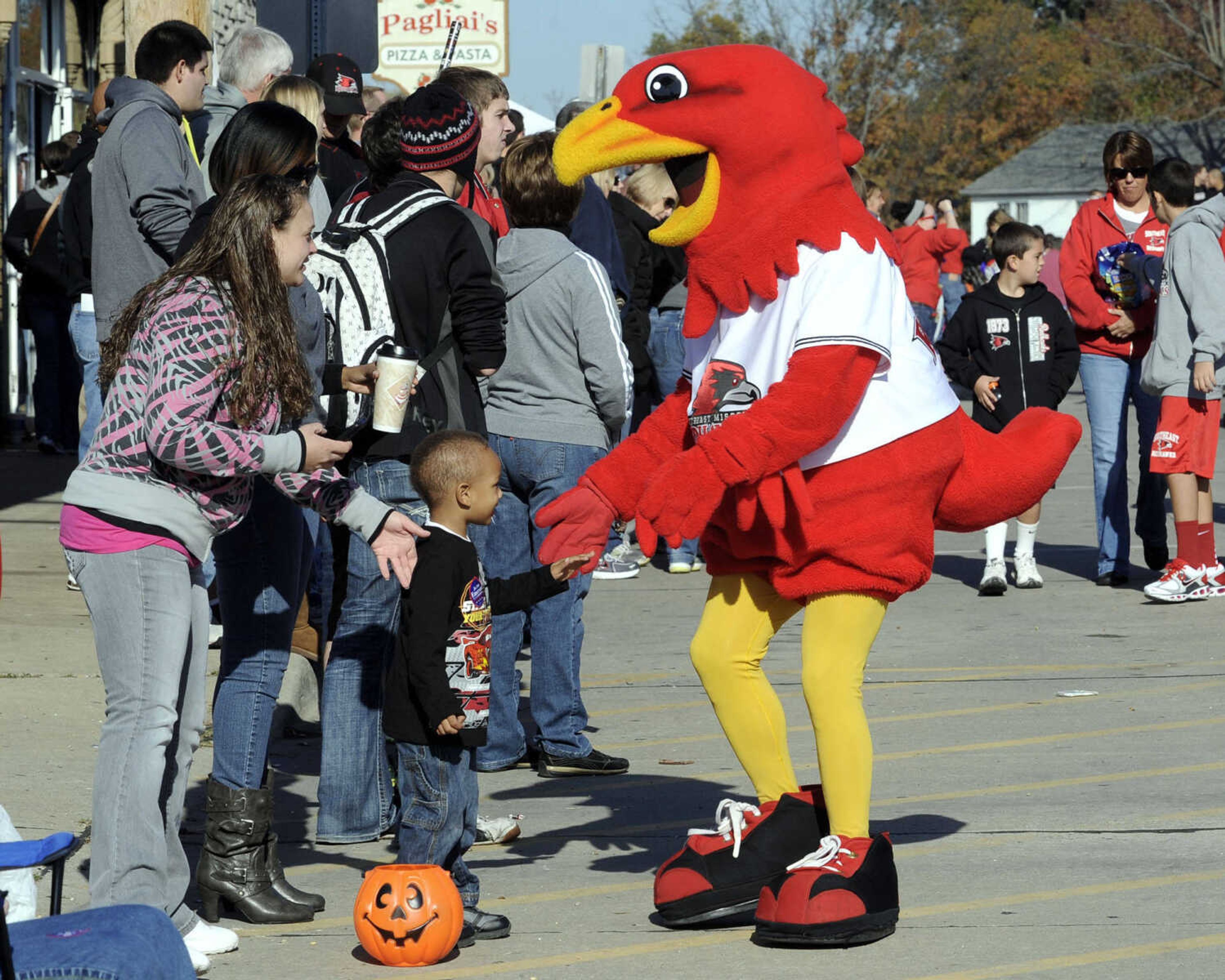 Rowdy Redhawk meets a fan along the parade route.