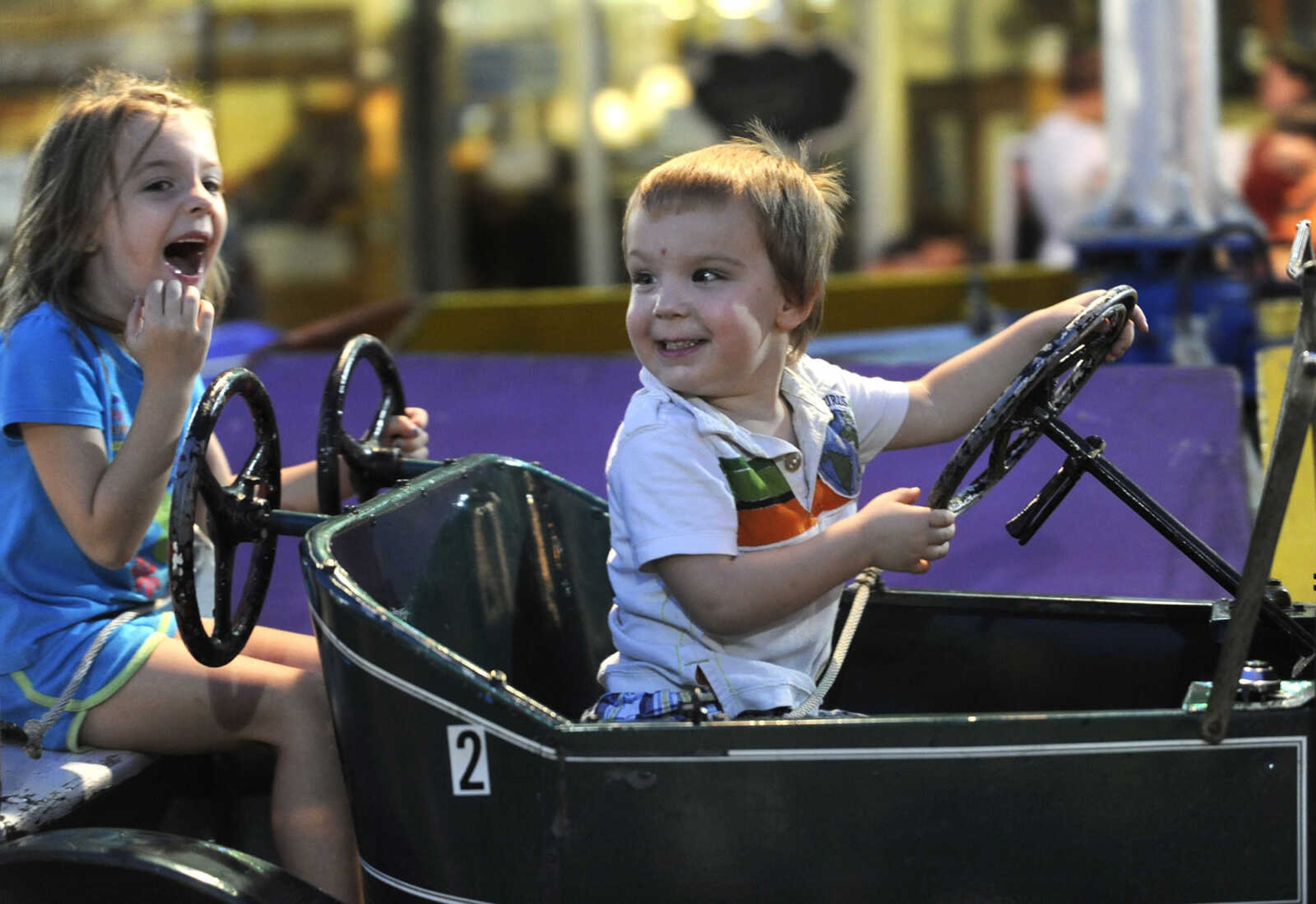 FRED LYNCH ~ flynch@semissourian.com
Logan Holloway takes his sister, Kiersten Holloway, both of Jackson, for a ride at Homecomers Friday, July 29, 2011.