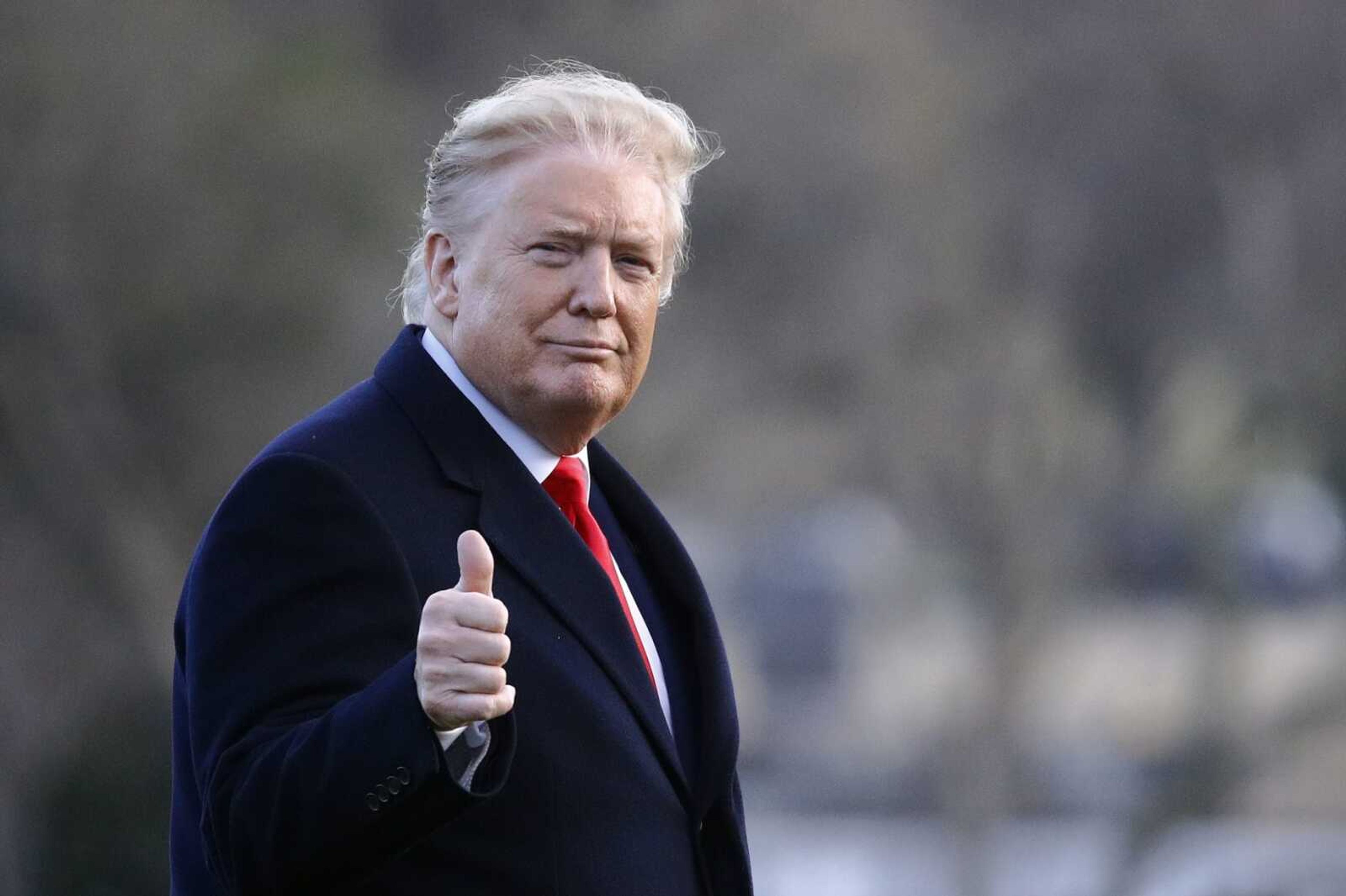 President Donald Trump gestures as he walks to the Oval Office of the White House in Washington, Friday, Feb. 7, 2020, after stepping off Marine One as he returns from a trip to Charlotte, N.C. (AP Photo/Patrick Semansky)