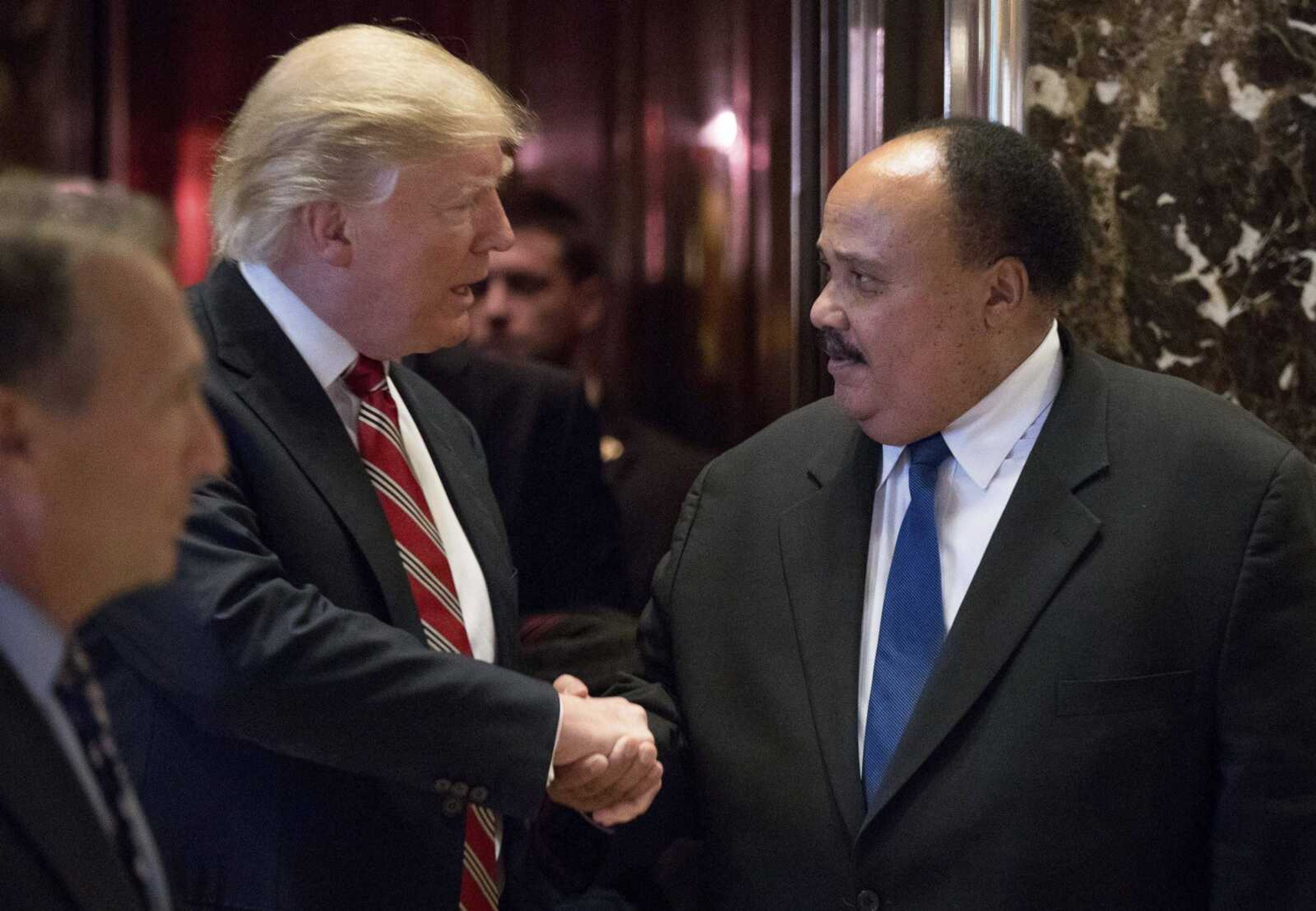 President-elect Donald Trump shakes hands Monday with Martin Luther King III, son of Martin Luther King Jr., at Trump Tower in New York.