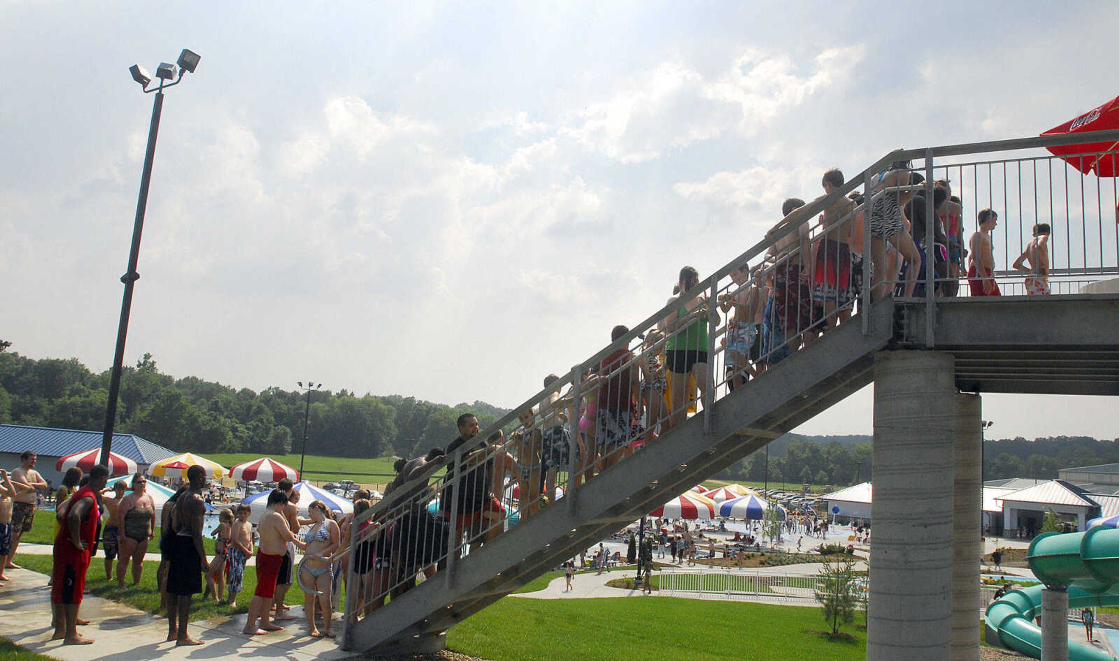 LAURA SIMON~lsimon@semissourian.com
People form a line for a chance to slide down the 177 ft. open flume and the 140 ft. enclosed flume Saturday, May 29, 2010 during the opening day of Cape Splash Family Auquatic Center.