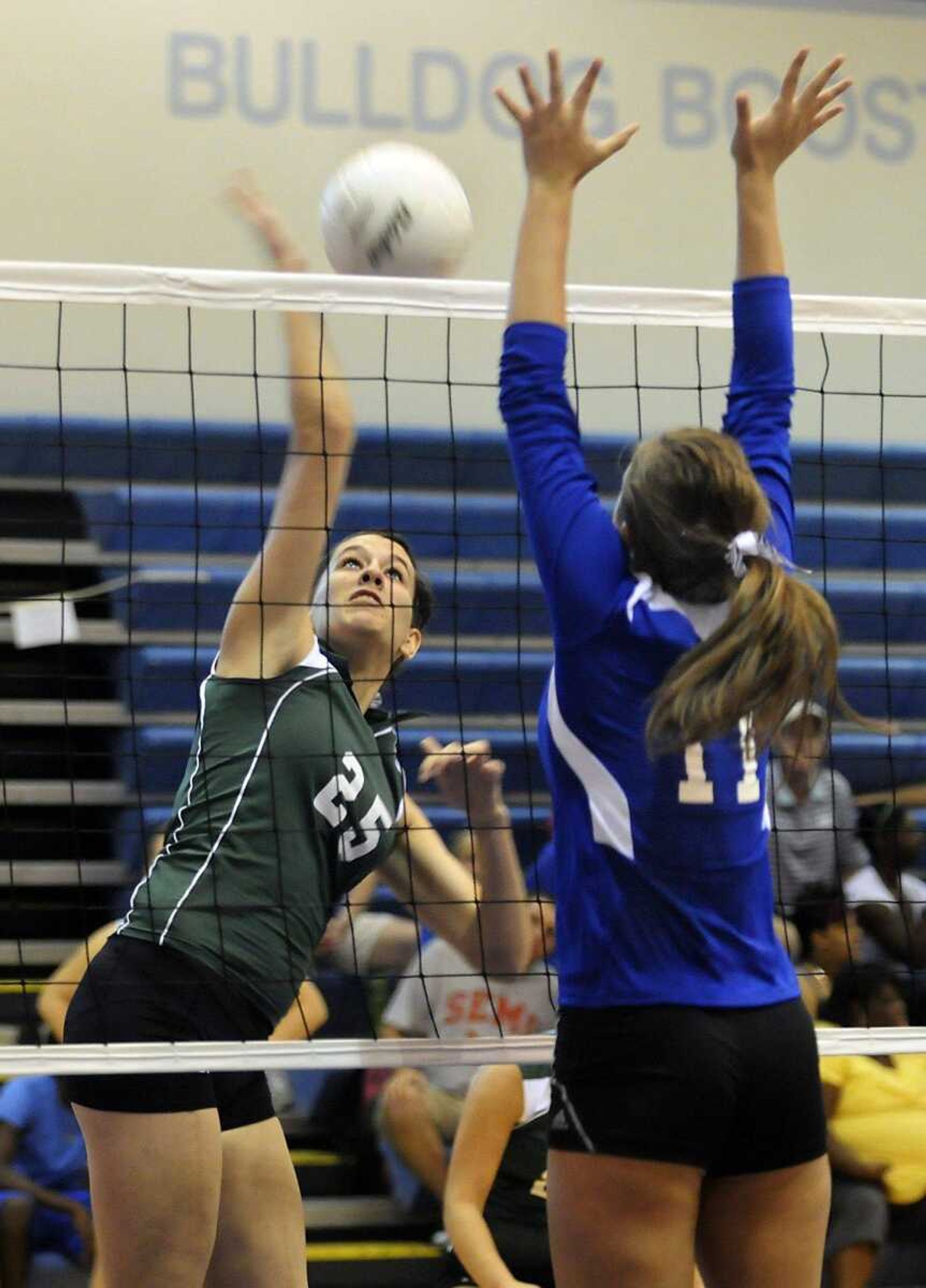 Perryville's Marissa Erwin spikes past Notre Dame's Jamie Brugger during the first game of Saturday's championship match.