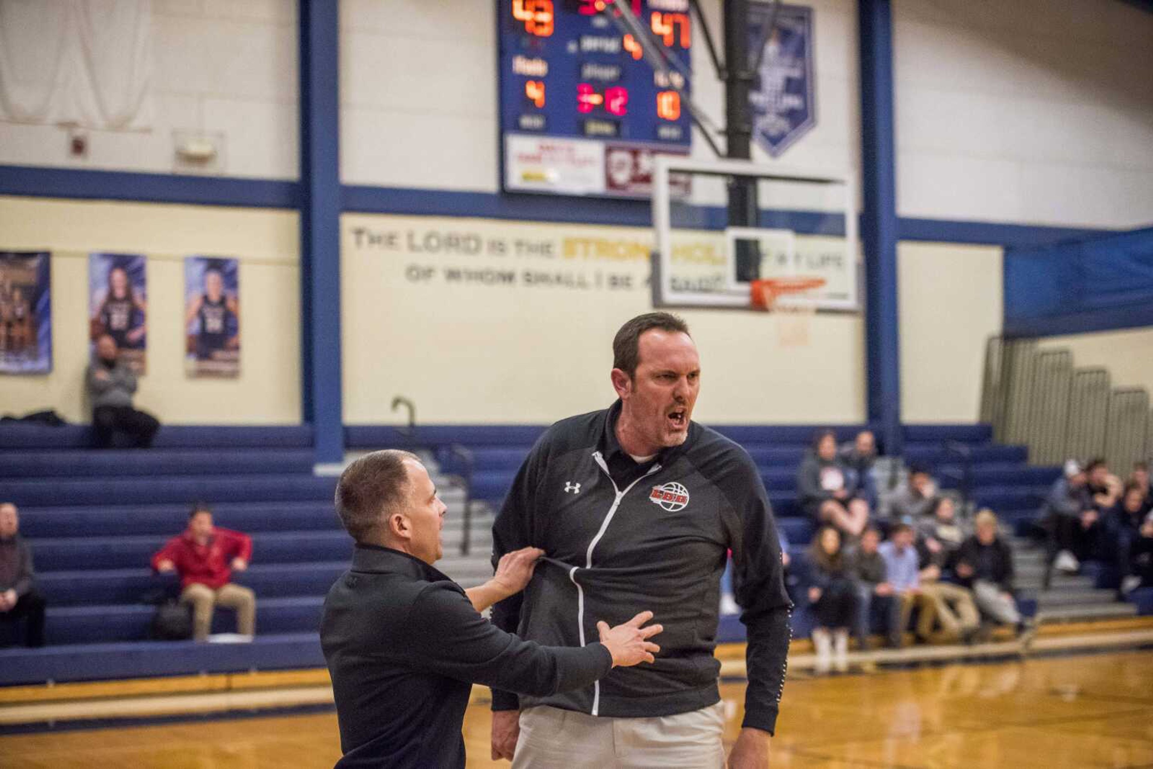 Head coach Chad Allen, far right, of Dexter, angrily defends his players after Saxony Lutheran head coach Sam Sides accused them of playing "dirty" as the game became increasingly physical in the fourth quarter at Saxony Lutheran Monday, Jan. 28, 2019. At this point in the game, Saxony Lutheran had pulled to within 4 points, but Dexter would go on to win 63-59.