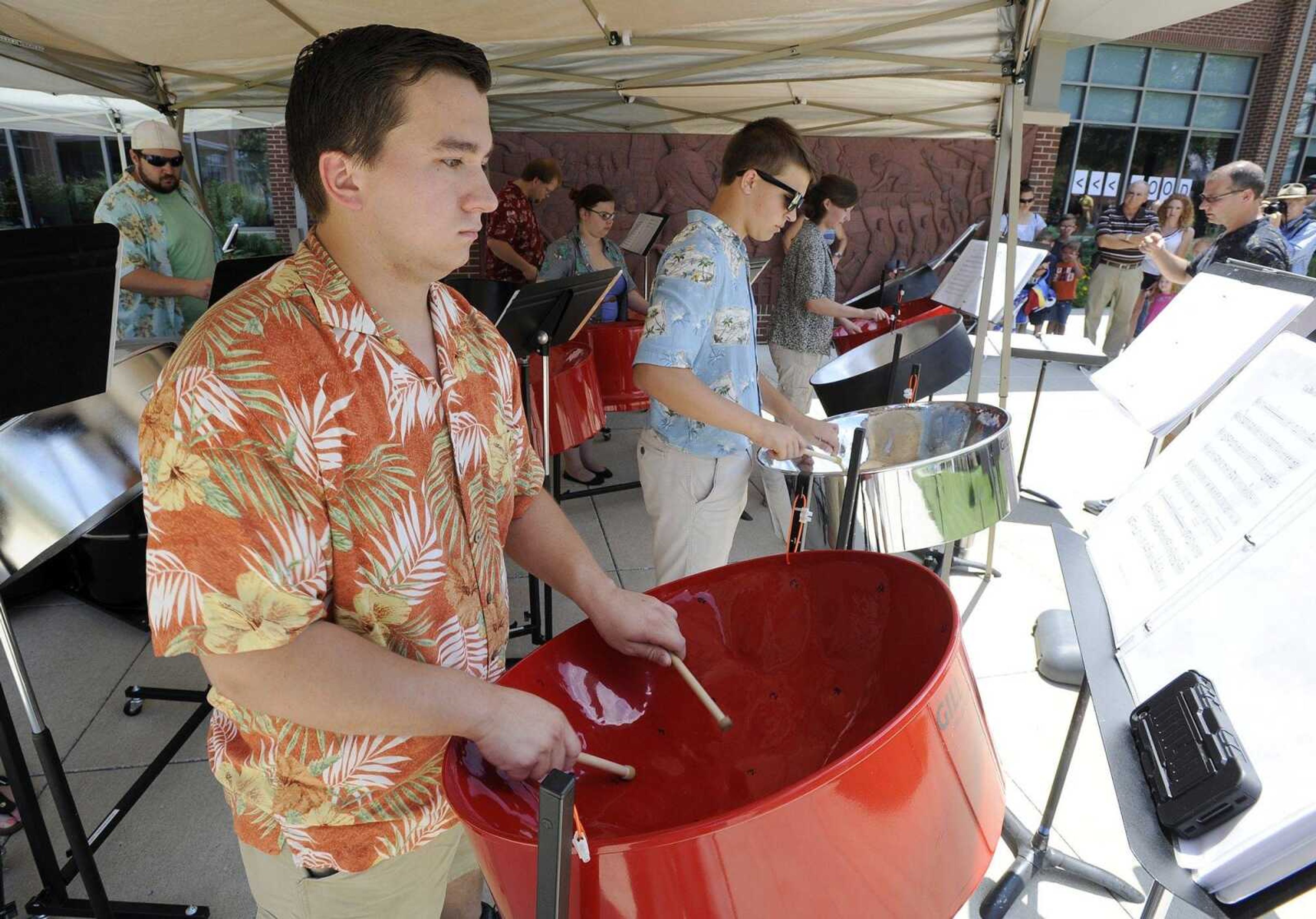 Solomon Melchior performs "La Bamba" with the Southeast Steel Drum Band, directed by Shane Mizicko, on Saturday at the Summer Arts Festival at the River Campus.