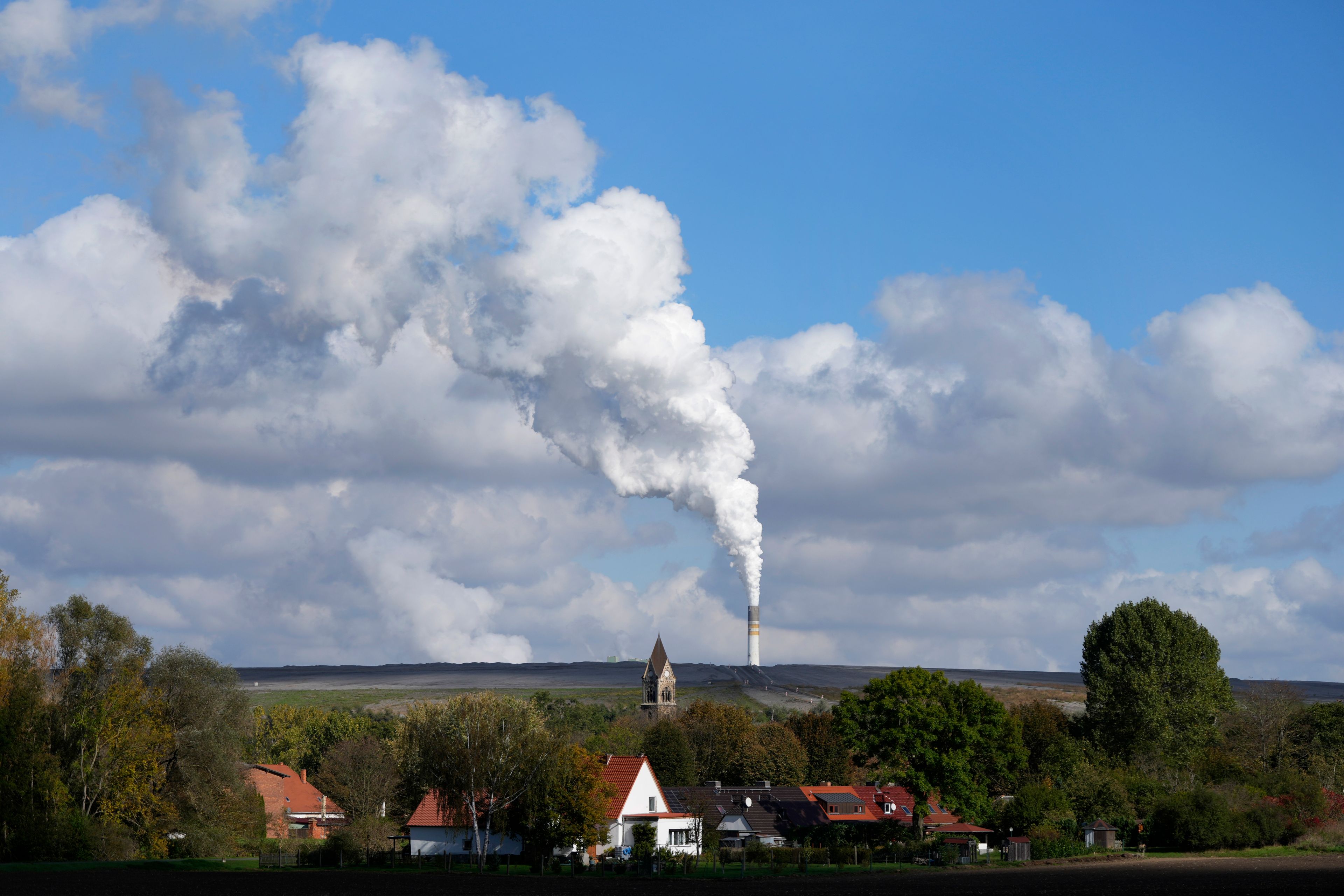 The Schkopau coal-fired power plant operates in Teutschenthal, near Halle, eastern Germany, Tuesday, Oct. 15, 2024. (AP Photo/Matthias Schrader)