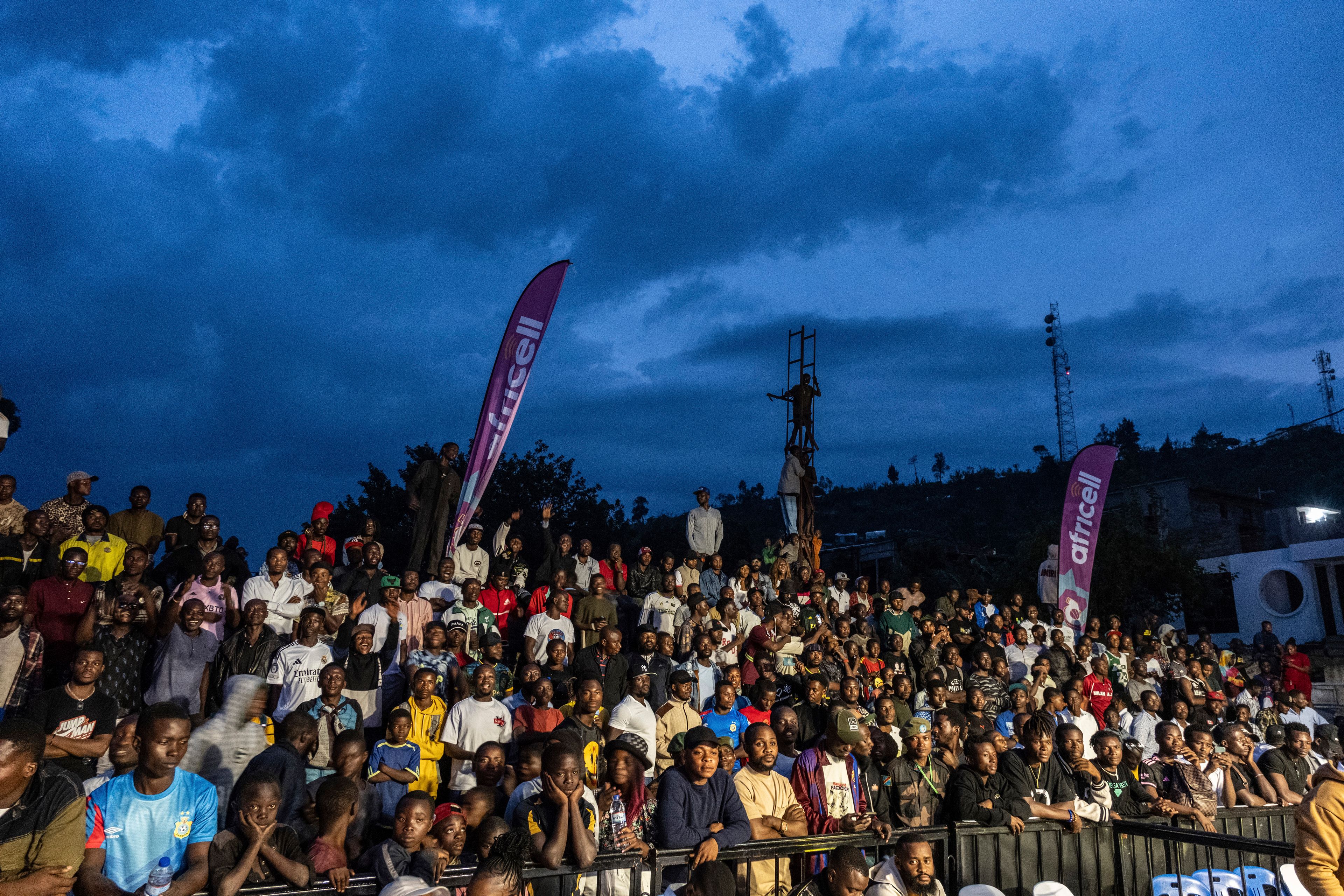 Crowds gather to see Daniella Mulekets, 20, fight in her first professional boxing match in Goma, Democratic republic of the Congo, Oct. 26 2024 on the 50th anniversary of the "Rumble in the Jungle" fight between Muhammad Ali and George Foreman in Kinshasa. (AP Photo/Moses Sawasawa)