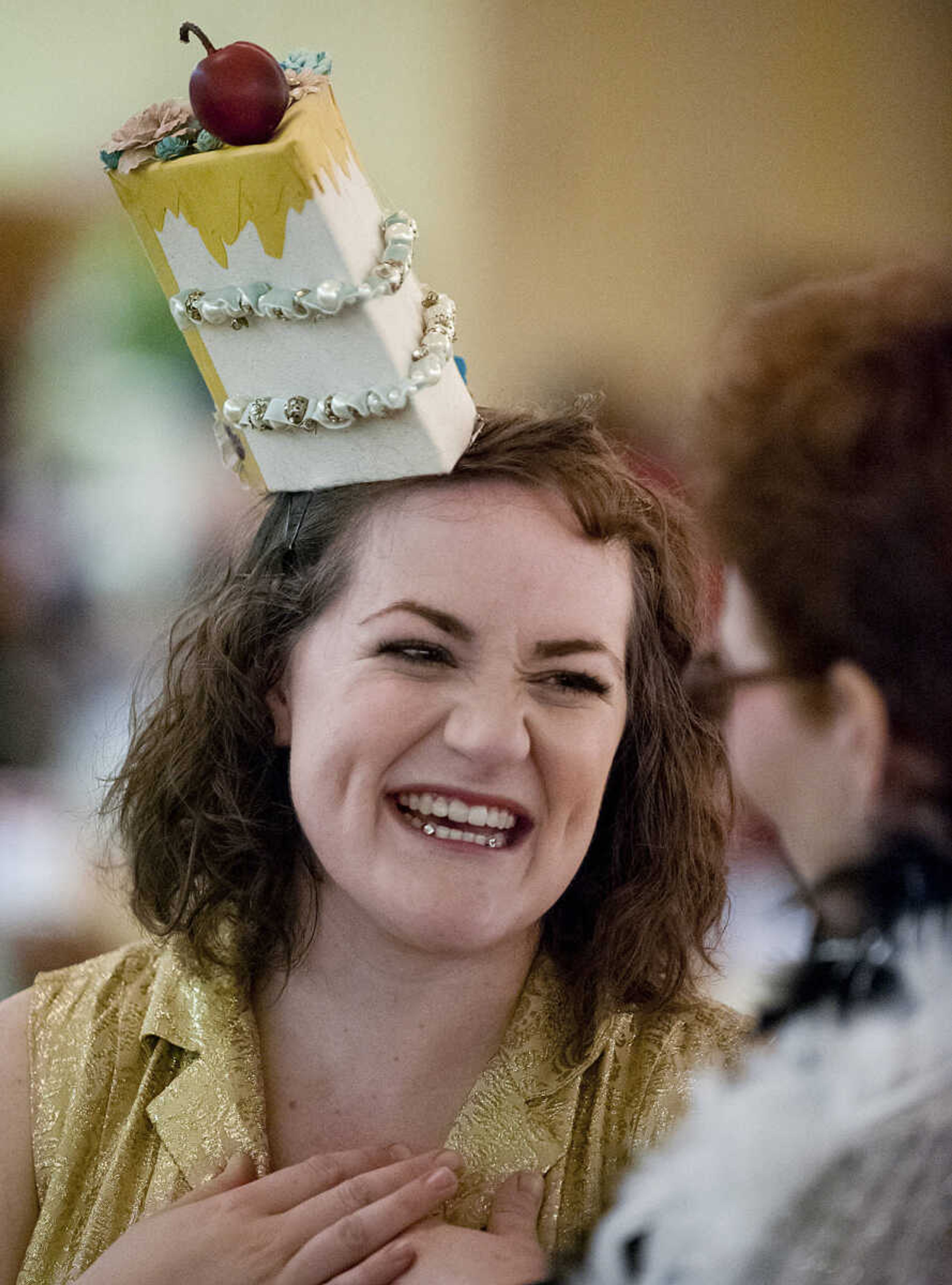 Becky Brown-Clements, of Cakes Reanimated, talks with Val Johnson at the Lutheran Family and Children's Services Foundation's "Boas & Bling, Kentucky Derby Party," Thursday, May 1, at The Venue in Cape Girardeau. More than 450 people attended the annual event  which is a fundraiser for the not-for-profit social services organization which provides counseling, adoption services, child care, youth mentoring services and advocacy on behalf of children and families.