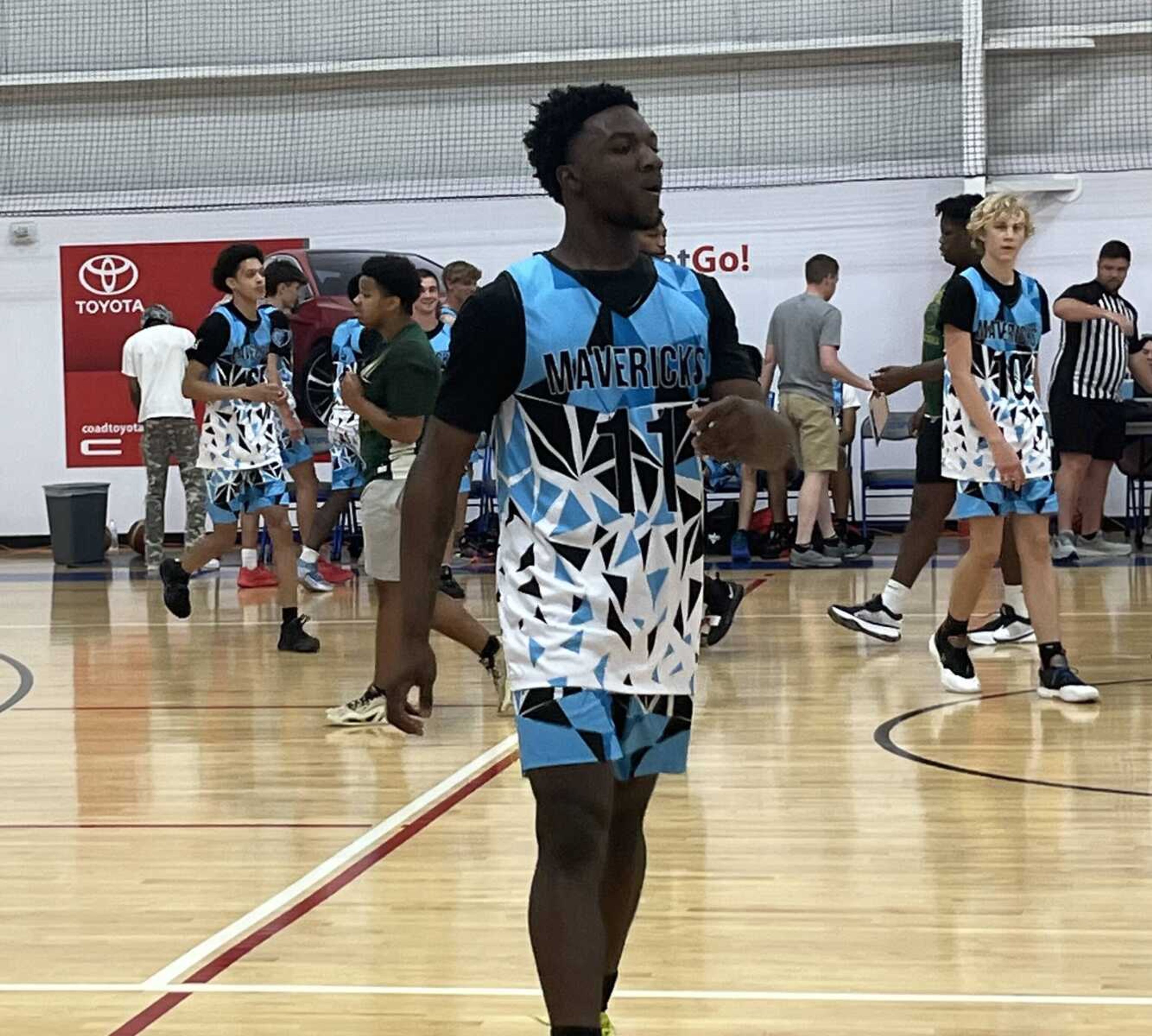 The Mavericks' Cartez Hopkins walks down the floor during a Summer League game against New Madrid County Central on June 11.