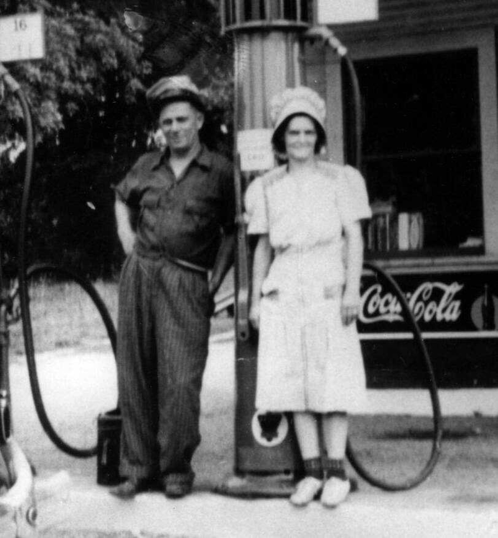 Homer and Madge Boswell stand in front of their Shell Service Station, 102 Mason, in 1940. 