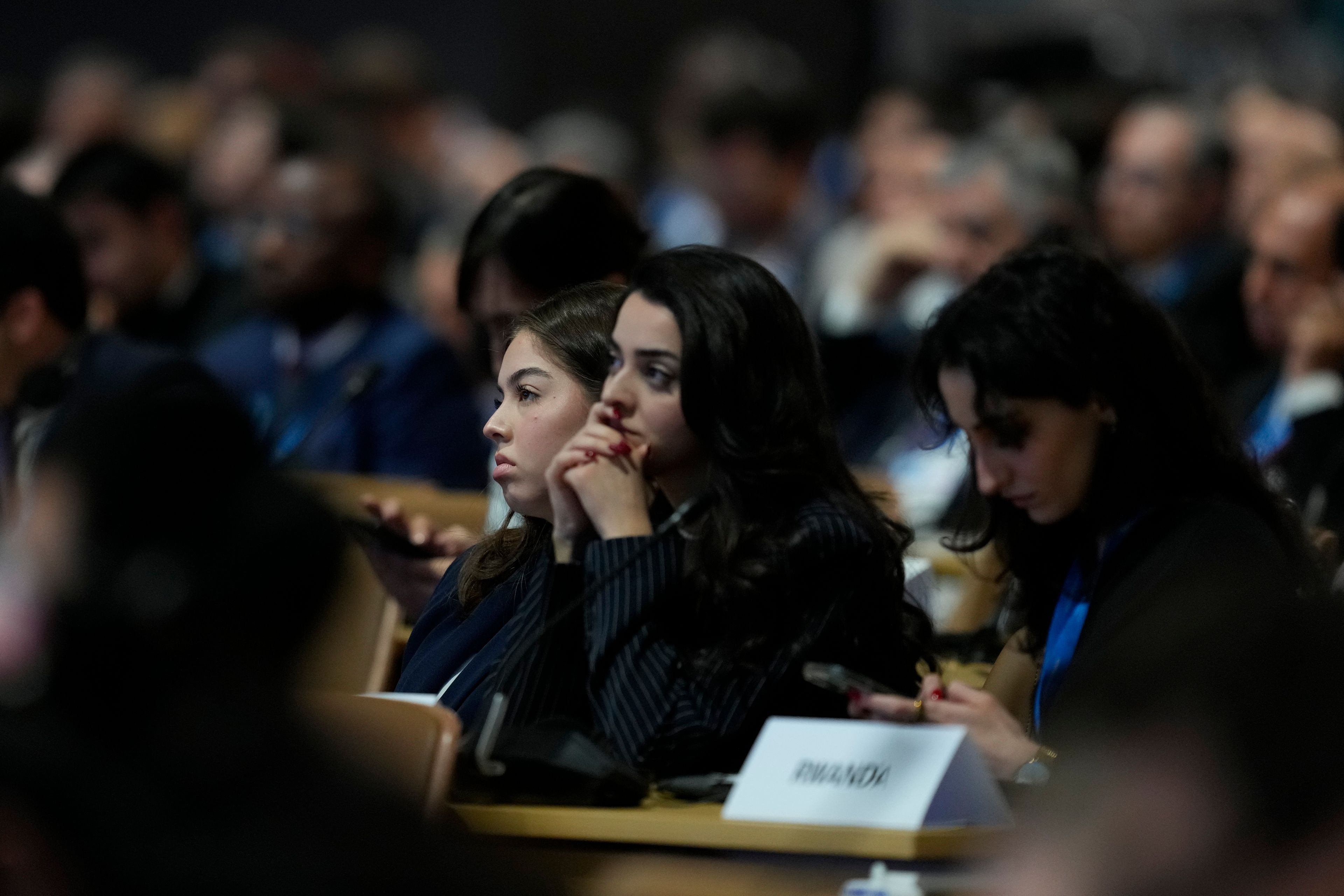 Attendees listen during a session on urbanization at the COP29 U.N. Climate Summit, Wednesday, Nov. 20, 2024, in Baku, Azerbaijan. (AP Photo/Rafiq Maqbool)