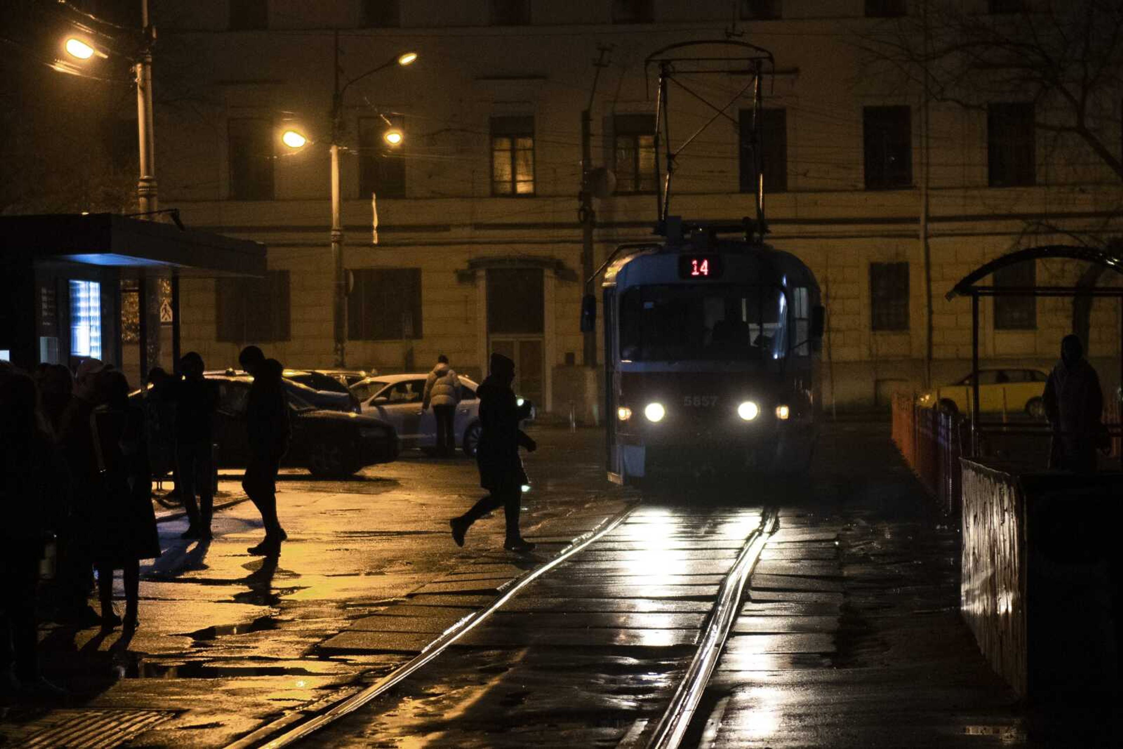 A tram arrives at a stop during a blackout Sudnay, Nov. 6, in Kyiv, Ukraine.