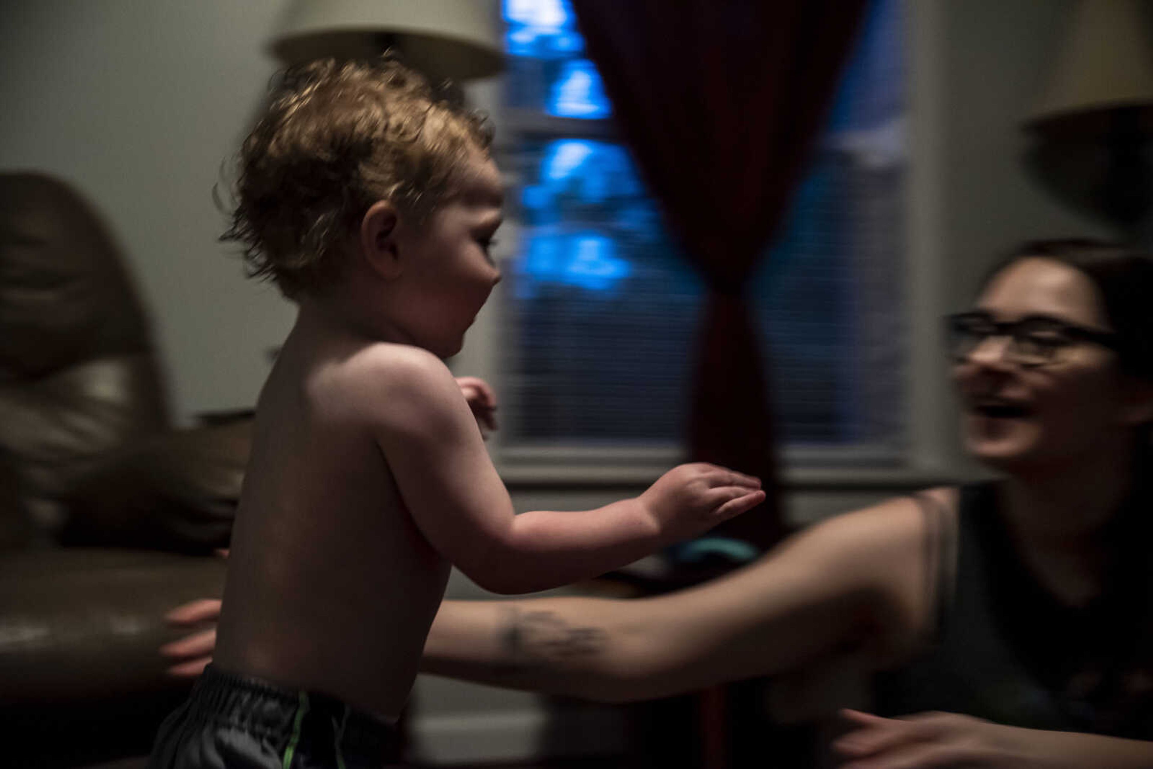 Phoenix Young, 2, runs into the arms of his mom, Emily Medlock, after taking a bath and getting ready for bed at home Tuesday, May 7, 2019, in Cape Girardeau.