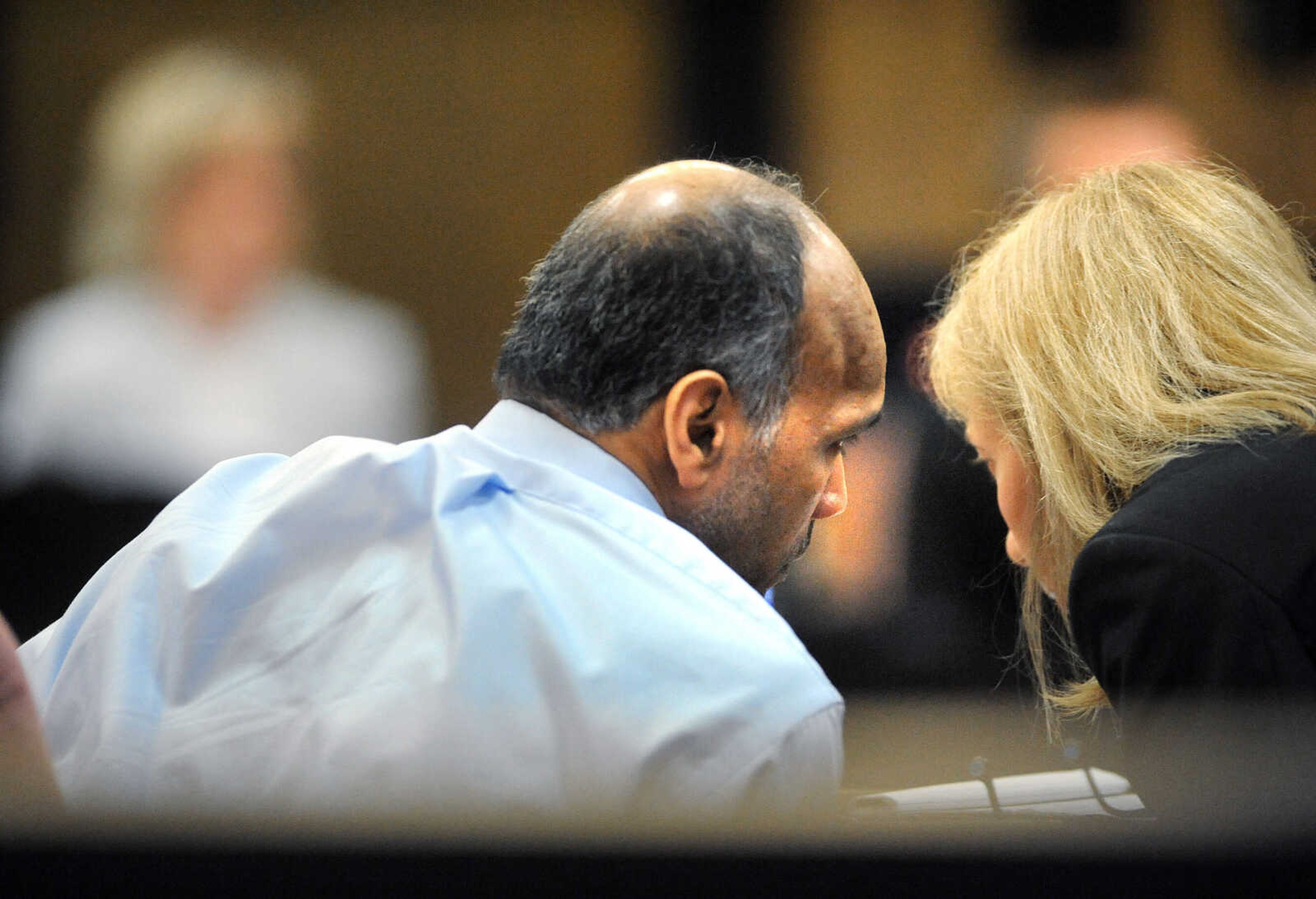 LAURA SIMON ~ lsimon@semissourian.com

George Joseph, left, chats with his attorney, Sharon Turlington, during double-murder trial, Monday, July 20, 2015, at the Cape Girardeau County Courthouse in Jackson, Missouri. Joseph is accused in the 2013 shooting deaths of his wife, Mary Joseph, and son, Matthew Joseph, at their home on West Cape Rock Drive.