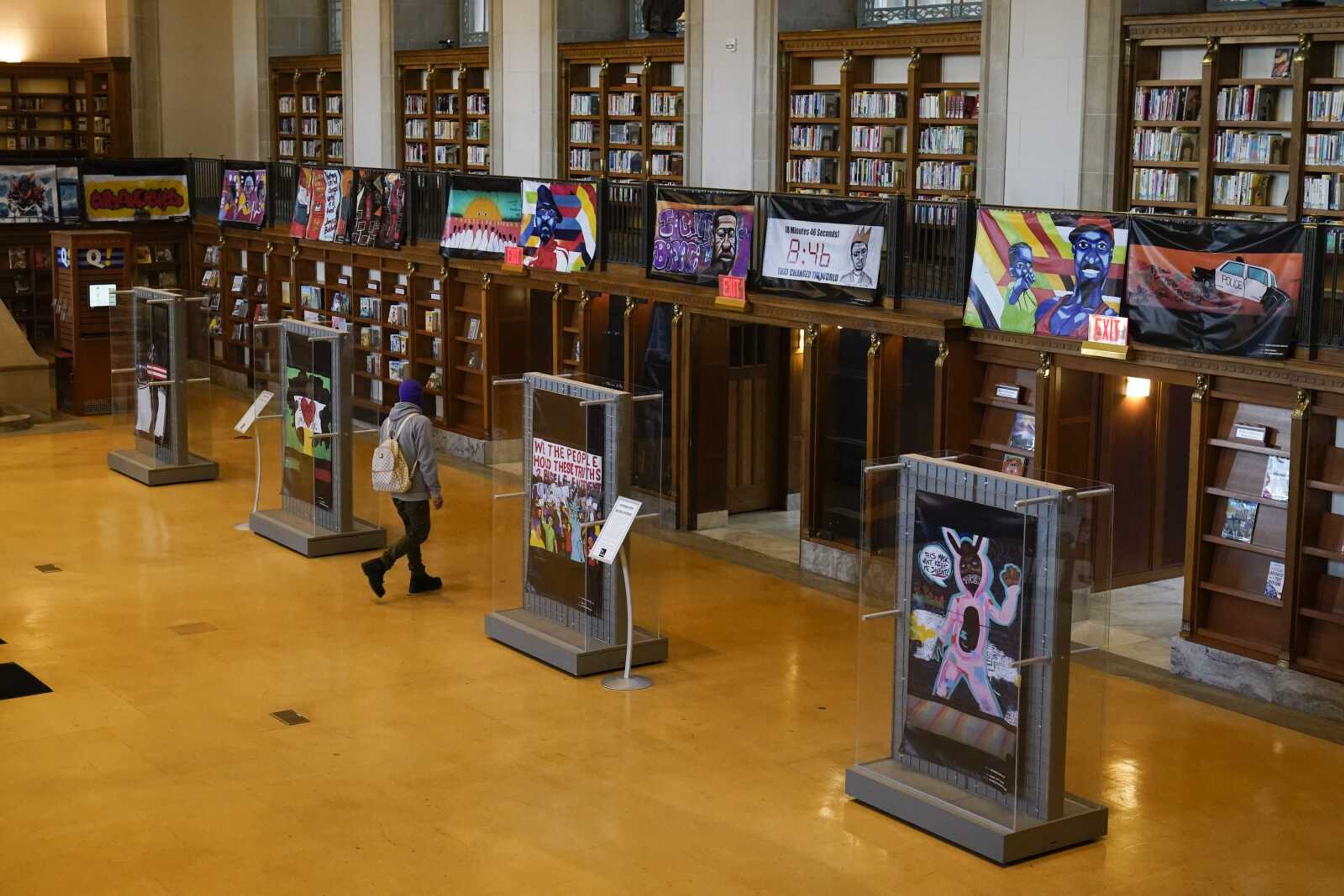 Vinyl banners representing the 24 murals that were painted in the downtown area of Indianapolis are displayed Thursday at the Central Library.