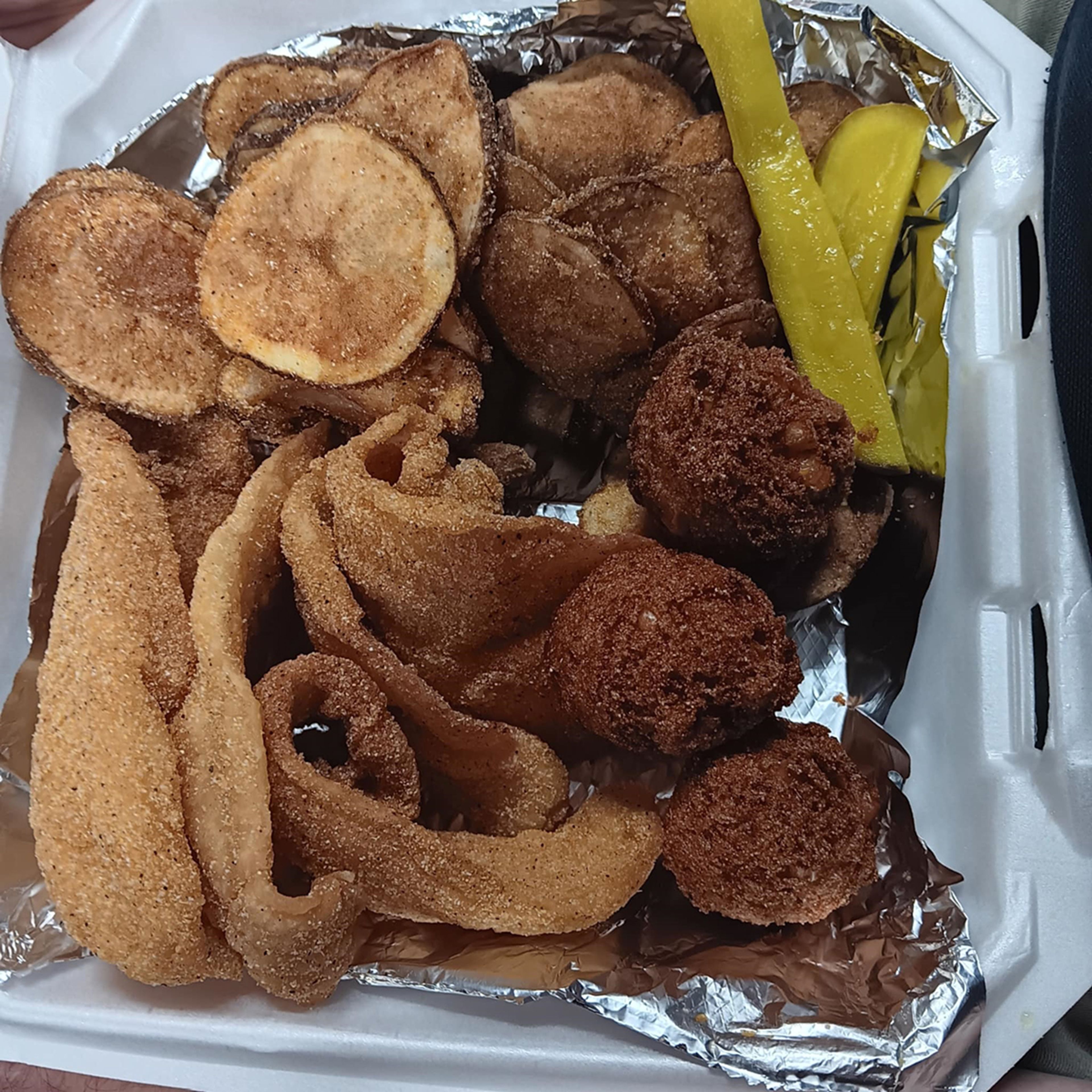 Fins & Feathers fish plate, full of fish, potatoes, and absolutely wonderful hushpuppies.