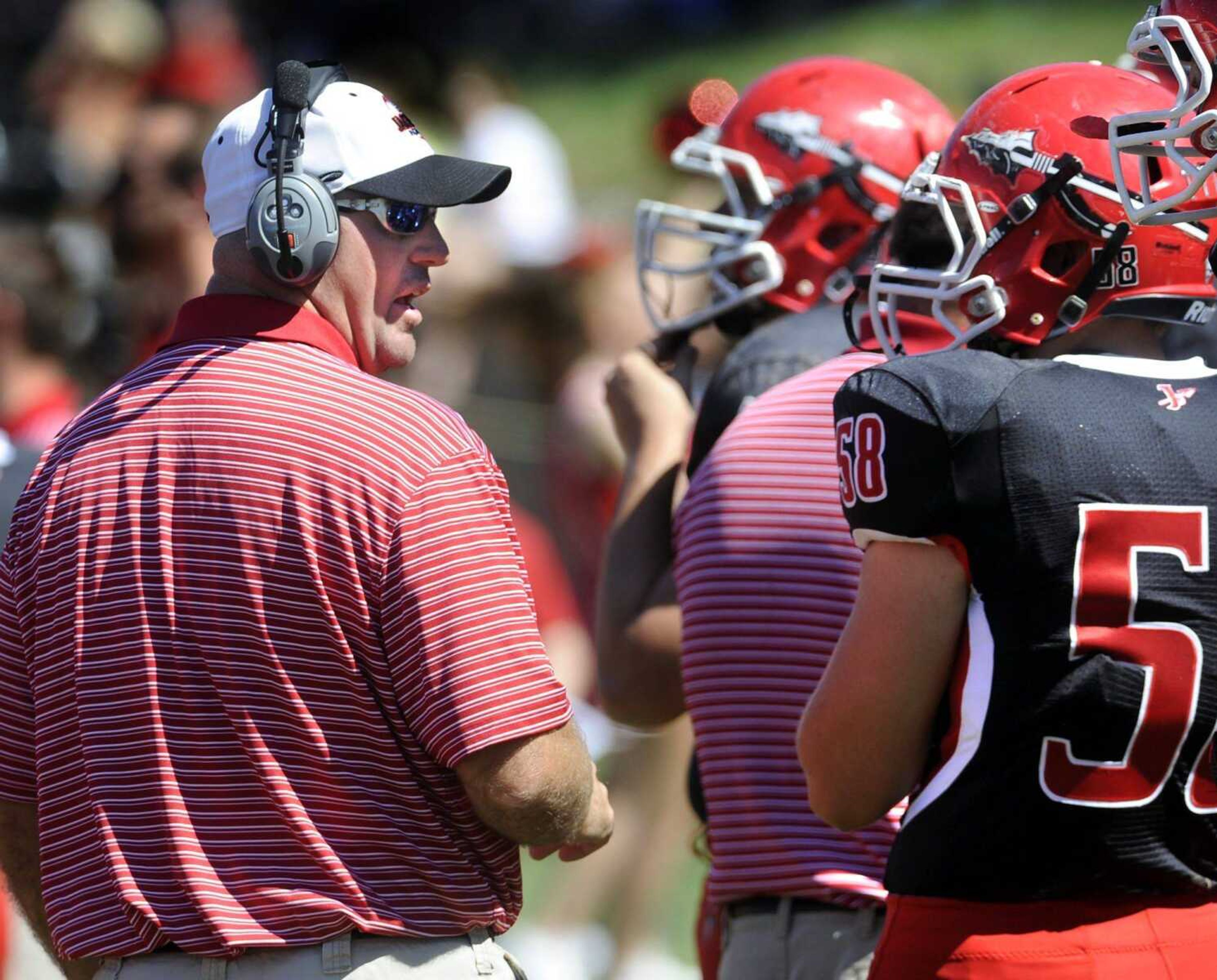 Jackson coach Brent Eckley talks to his players on the sideline during the first quarter Saturday, Sept. 8, 2012 at Jackson High School. (Fred Lynch)