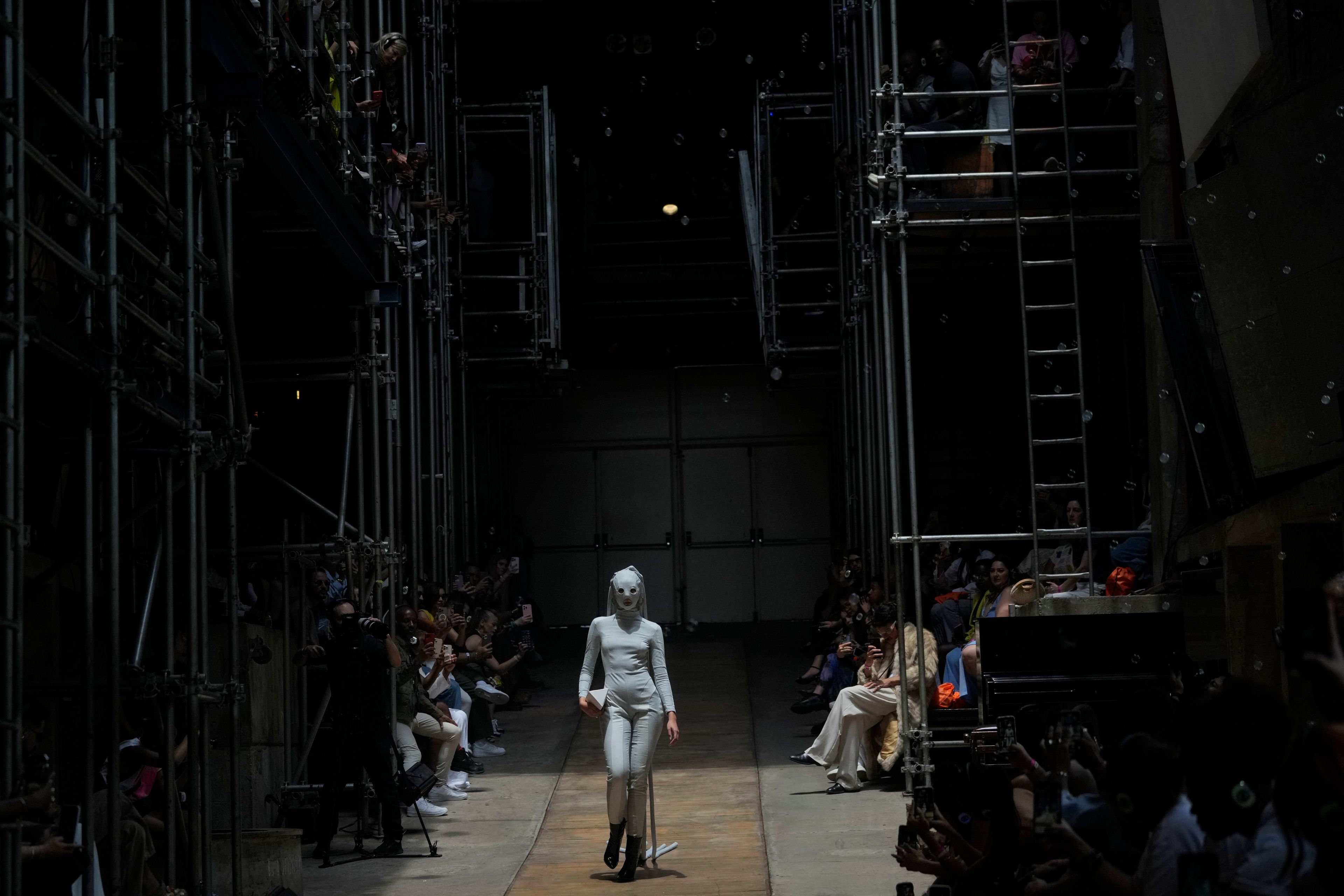 A model wears a creation from the As Marias collection at the Oficina Theater during Sao Paulo Fashion Week in Sao Paulo, Brazil, Friday, Oct. 18, 2024. (AP Photo/Andre Penner)