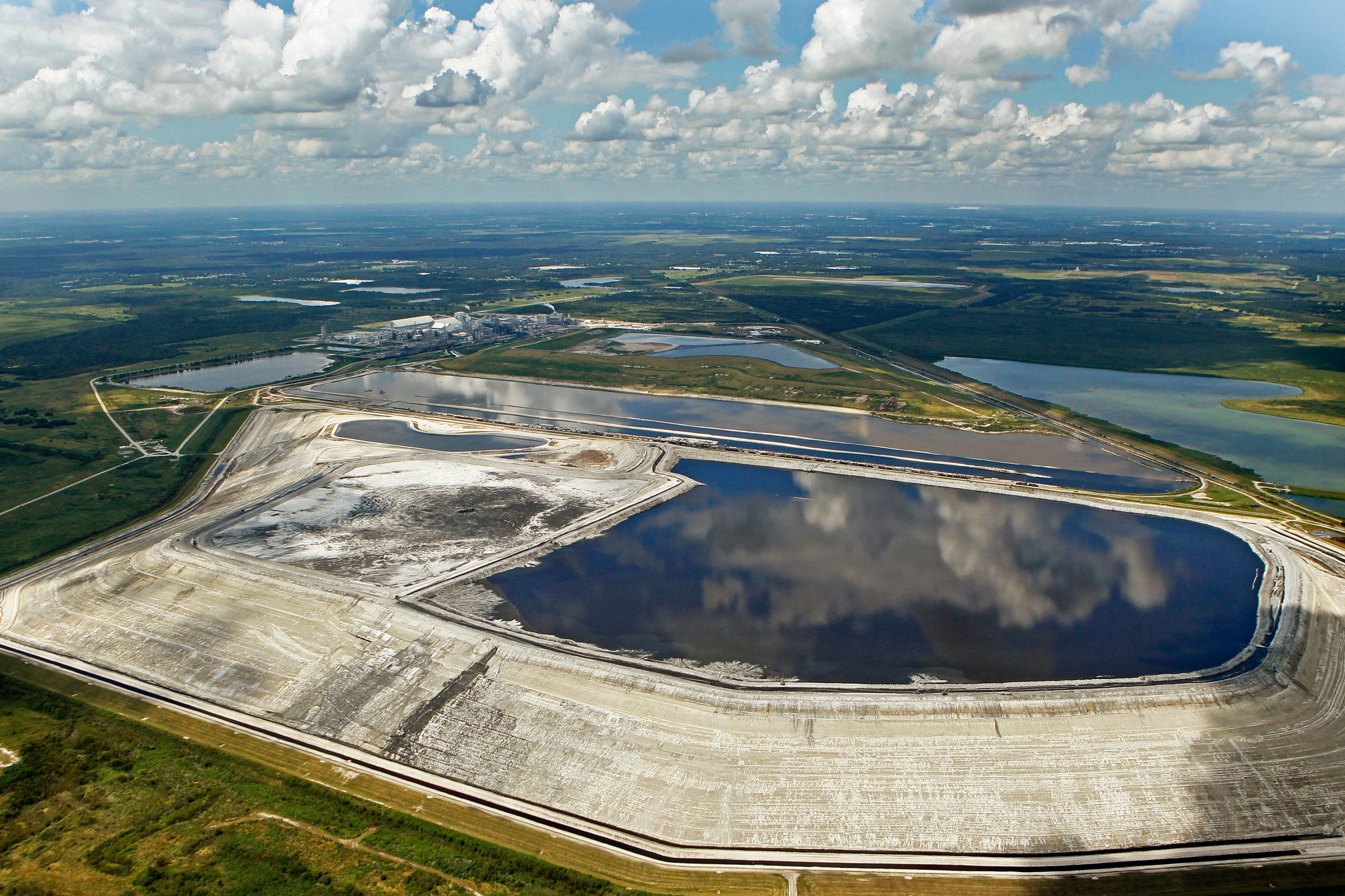 FILE - A sinkhole that opened up underneath a gypsum stack at a Mosaic phosphate fertilizer plant is seen in Mulberry, Fla., on Sept. 16, 2016. (Jim Damaske/Tampa Bay Times via AP, File)