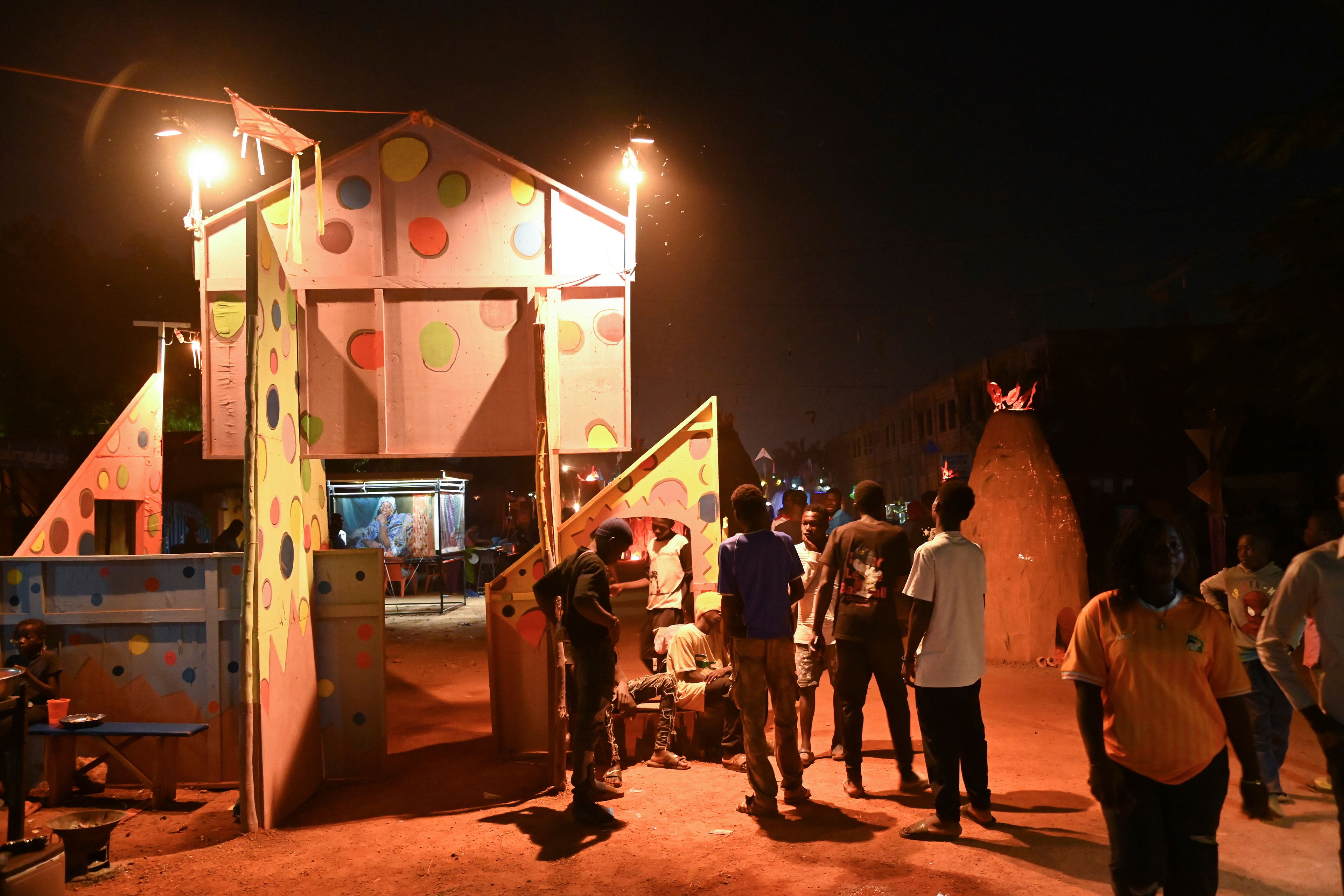 People gather for Recreatrales, an international theater festival held in Ouagadougou, Burkina Faso, Monday, Oct. 28, 2024. (AP Photo/Kilaye Bationo)